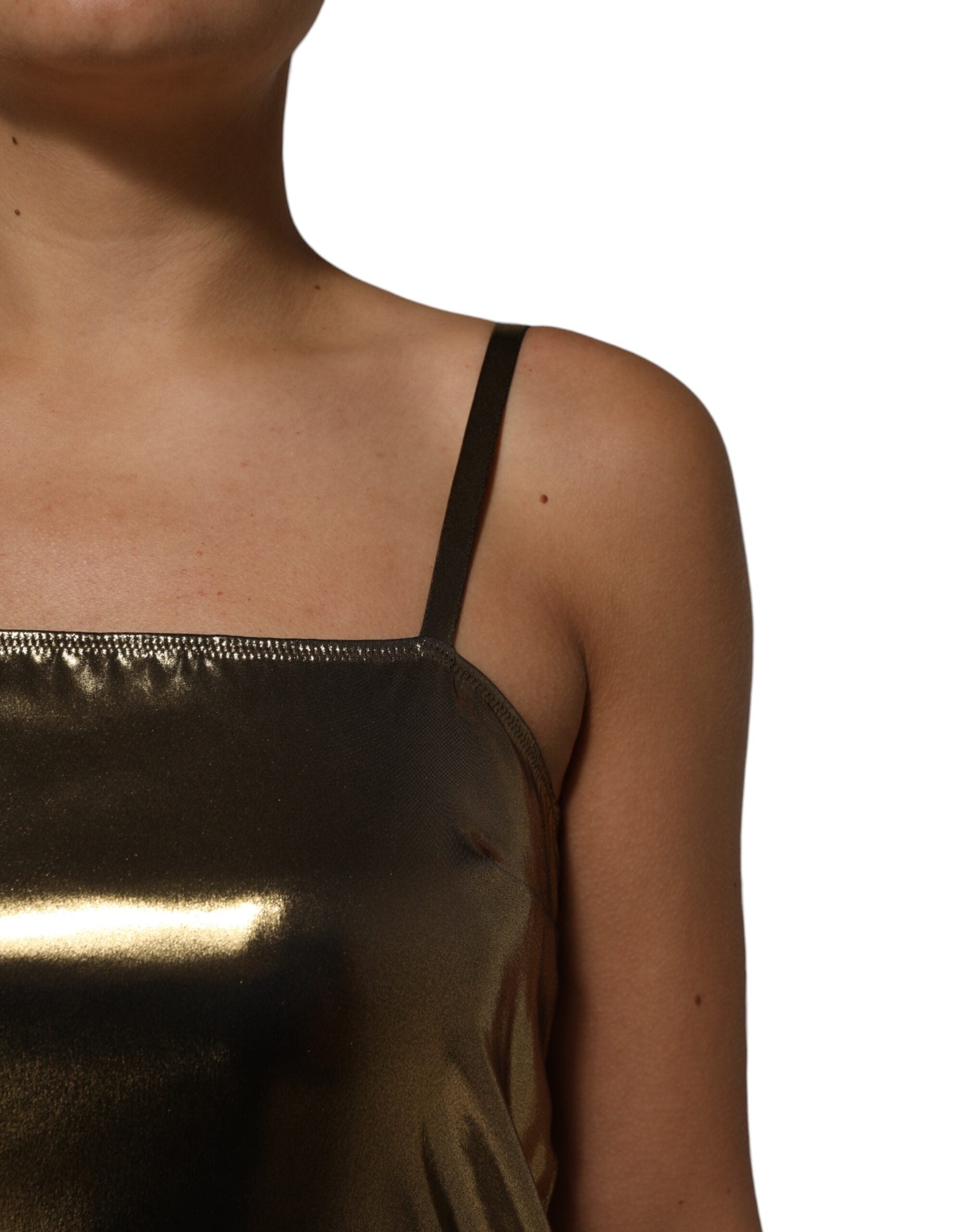 Elevate your style with the Dolce & Gabbana Metallic Gold Sleeveless A-line Mini Dress, a masterpiece of Italian craftsmanship that embodies luxury and sophistication.