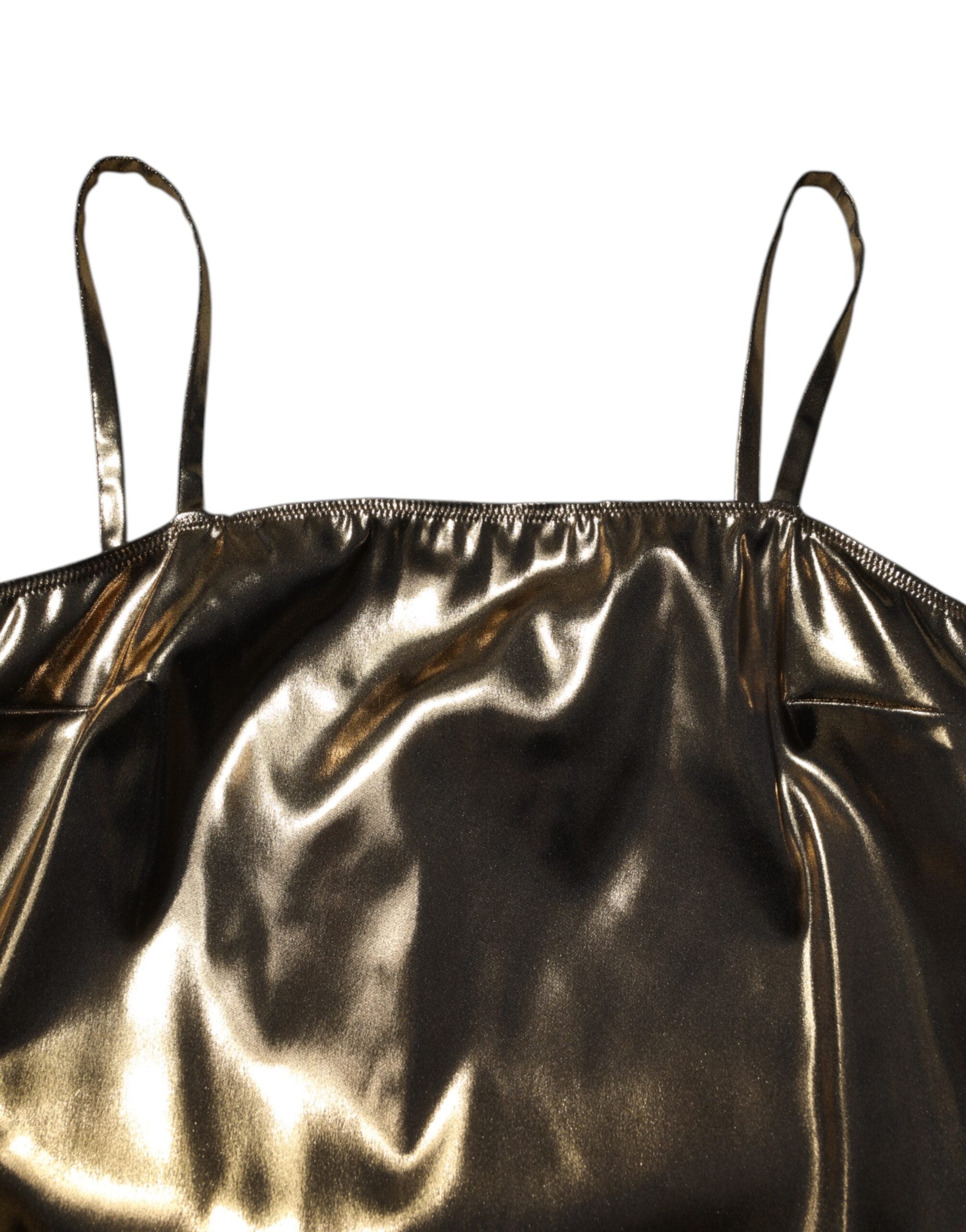 Experience the allure of the Dolce & Gabbana Metallic Gold Sleeveless A-line Mini Dress, a masterpiece of Italian craftsmanship that redefines luxury and elegance.