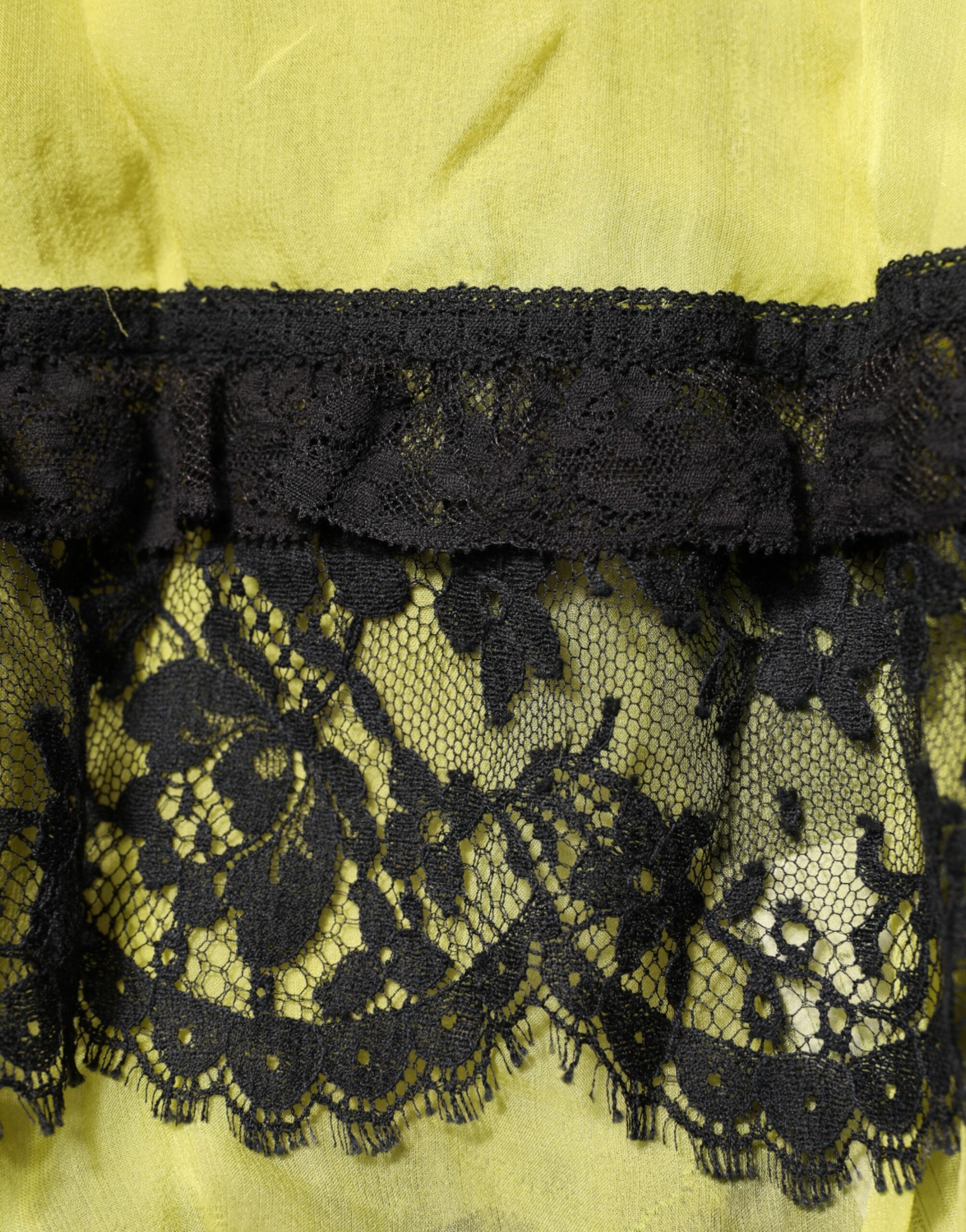 Indulge in the Dolce & Gabbana Yellow Black Babydoll Chemise, a masterpiece of silk and lace that embodies elegance and sensuality, perfect for the discerning individual.