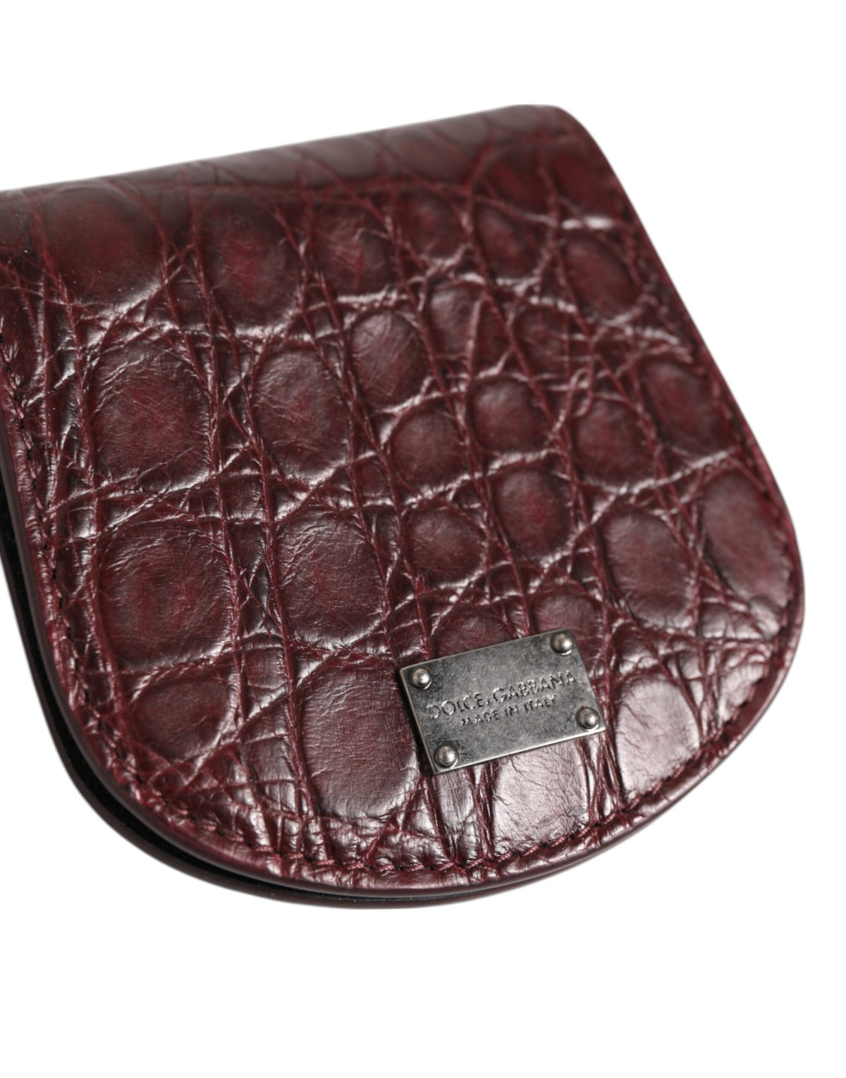 Discover the Dolce & Gabbana Burgundy Exotic Skin Coin Condom Case Holder, a luxurious blend of 100% Caiman Leather and Italian craftsmanship, perfect for the discerning individual.