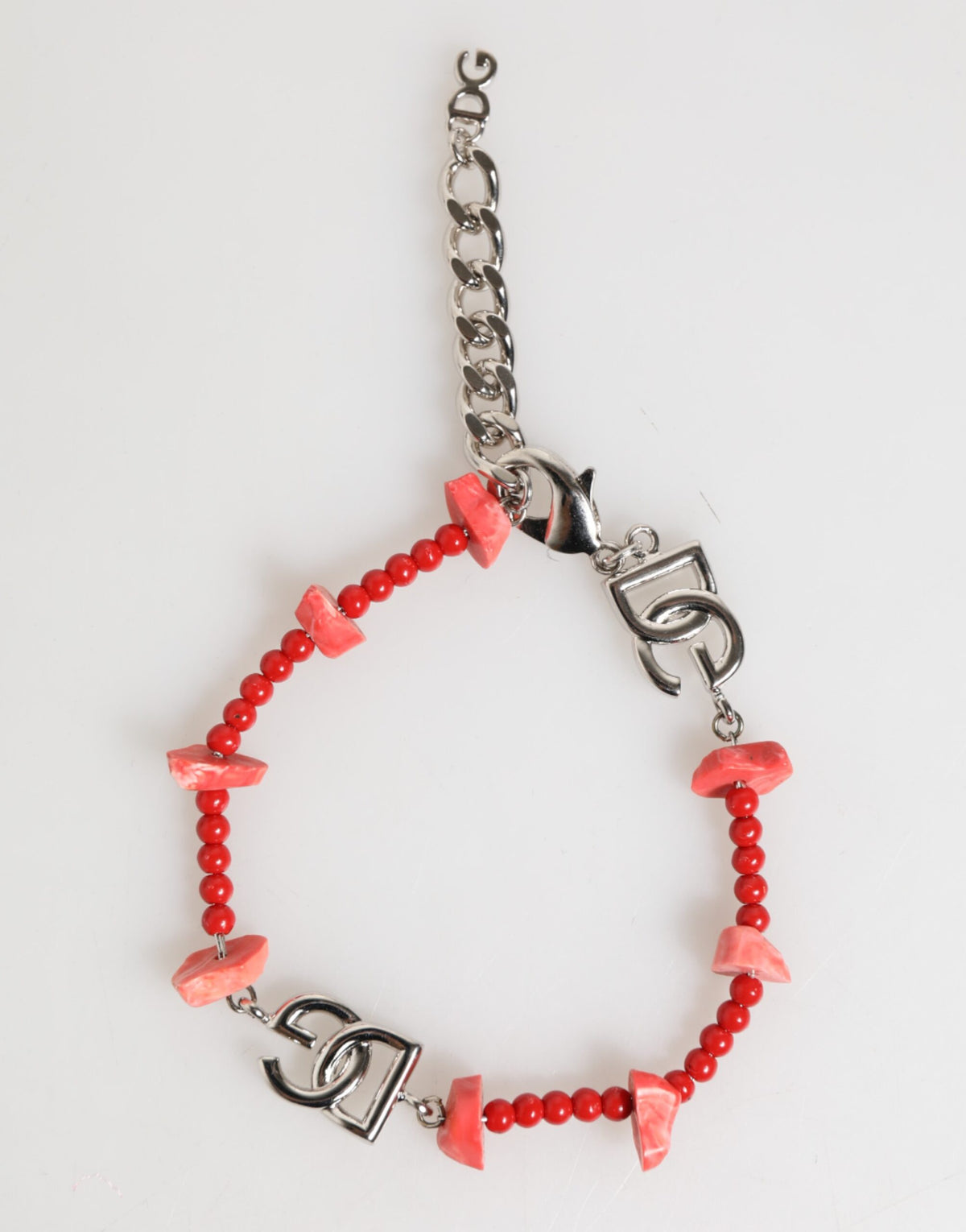 Elevate your style with the Dolce & Gabbana Silver Tone Brass Beaded Resin DG Logo Chain Bracelet, a masterpiece of Italian craftsmanship that embodies timeless elegance and sophistication.