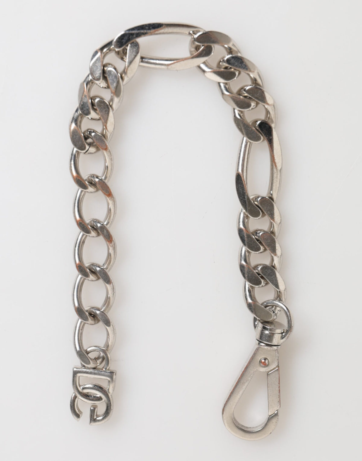 Discover the Dolce & Gabbana Silver Tone Brass Chain Lobster Clasp DG Logo Bracelet, an exquisite blend of Italian craftsmanship and timeless elegance, perfect for the discerning individual.