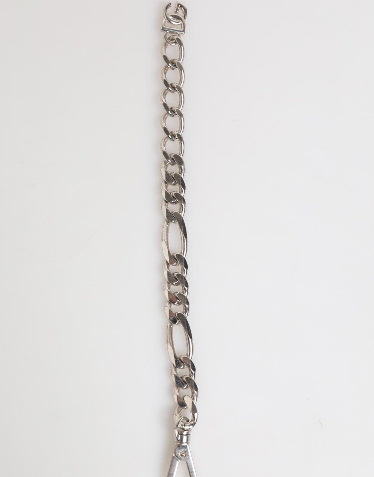 Discover the allure of the Dolce & Gabbana Silver Tone Brass Chain DG Logo Bracelet, a testament to exquisite craftsmanship and timeless elegance, perfect for the discerning individual.
