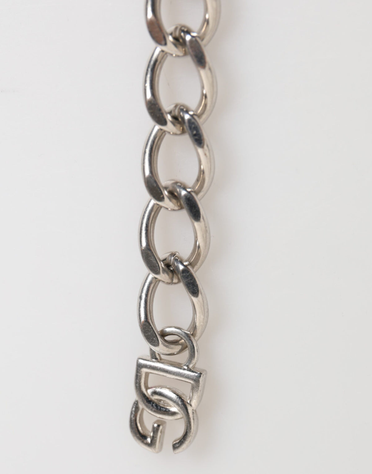Elevate your style with the Dolce & Gabbana Silver Tone Brass Chain Lobster Clasp DG Logo Bracelet, a testament to Italian luxury and exquisite craftsmanship.