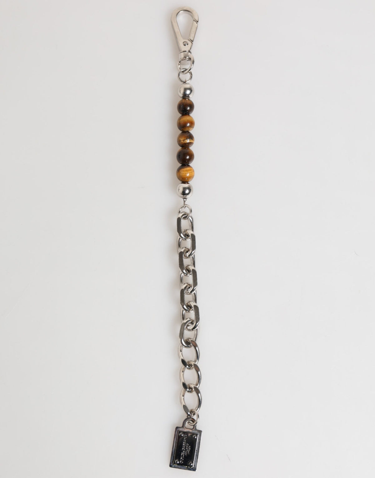 Indulge in the exquisite Dolce & Gabbana Silver Chain Brass Beaded Lobster Clasp Bracelet, a masterpiece of Italian craftsmanship that embodies timeless elegance and luxurious allure.