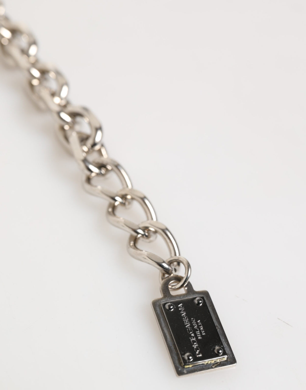 Indulge in the exquisite Dolce & Gabbana Silver Chain Bracelet, a masterpiece of Italian craftsmanship blending real brass and natural gems for timeless elegance.