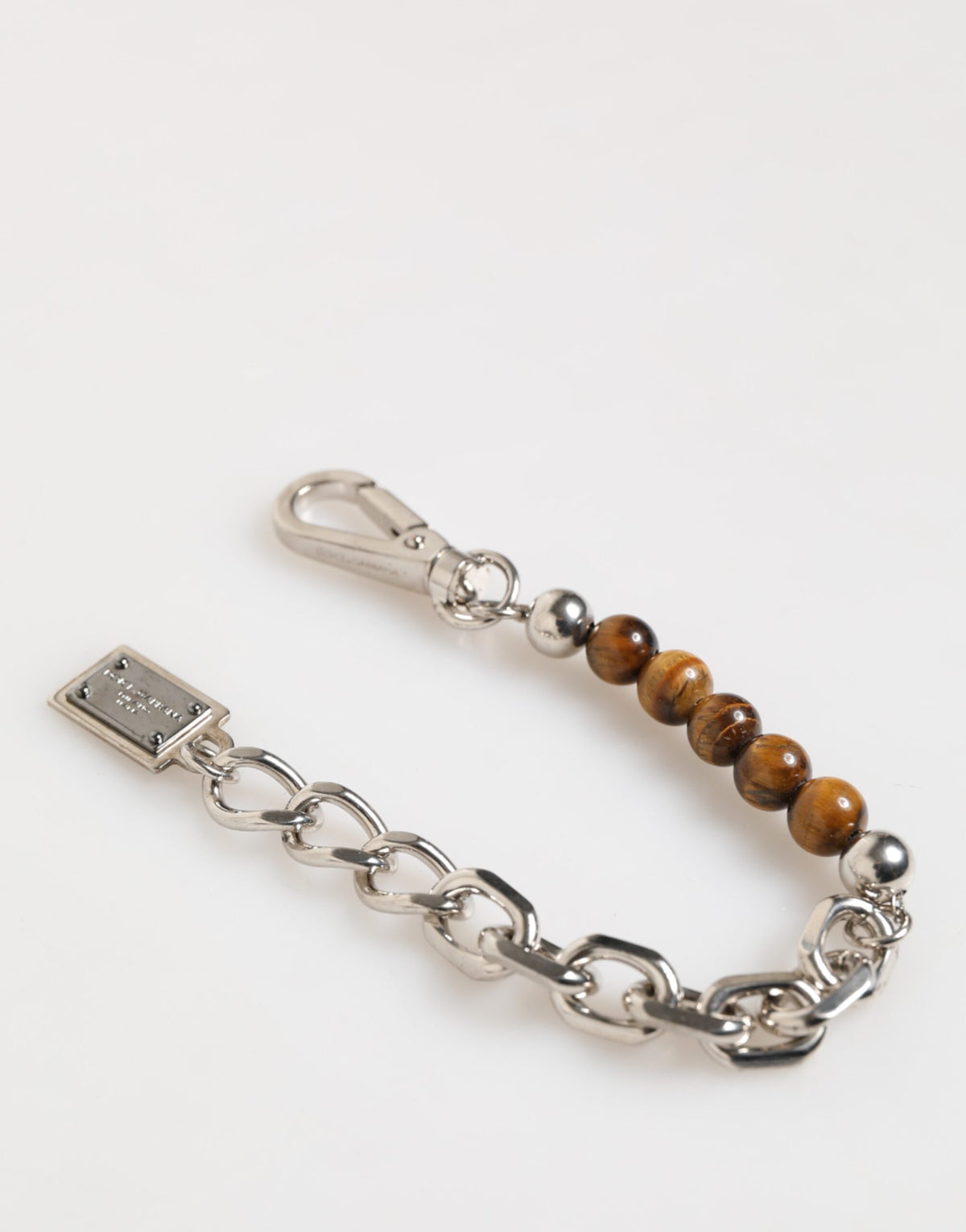 Indulge in the exquisite Dolce & Gabbana Silver Chain Brass Beaded Bracelet, a symbol of Italian artistry and timeless elegance, perfect for the discerning individual.
