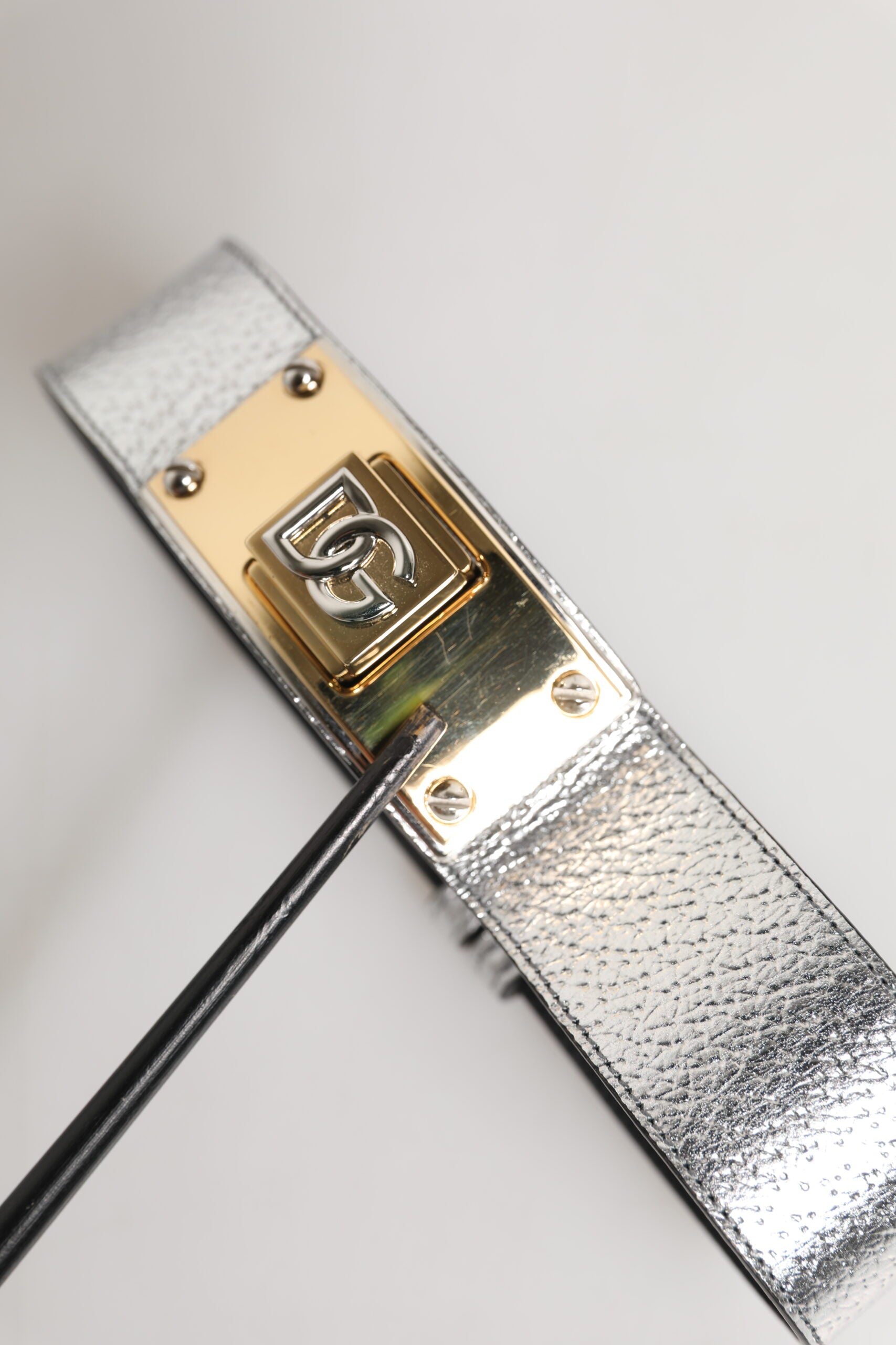 Indulge in the exquisite allure of the Dolce & Gabbana Silver Textured Leather Neckband, a luxurious statement piece that embodies Italian craftsmanship and timeless elegance.