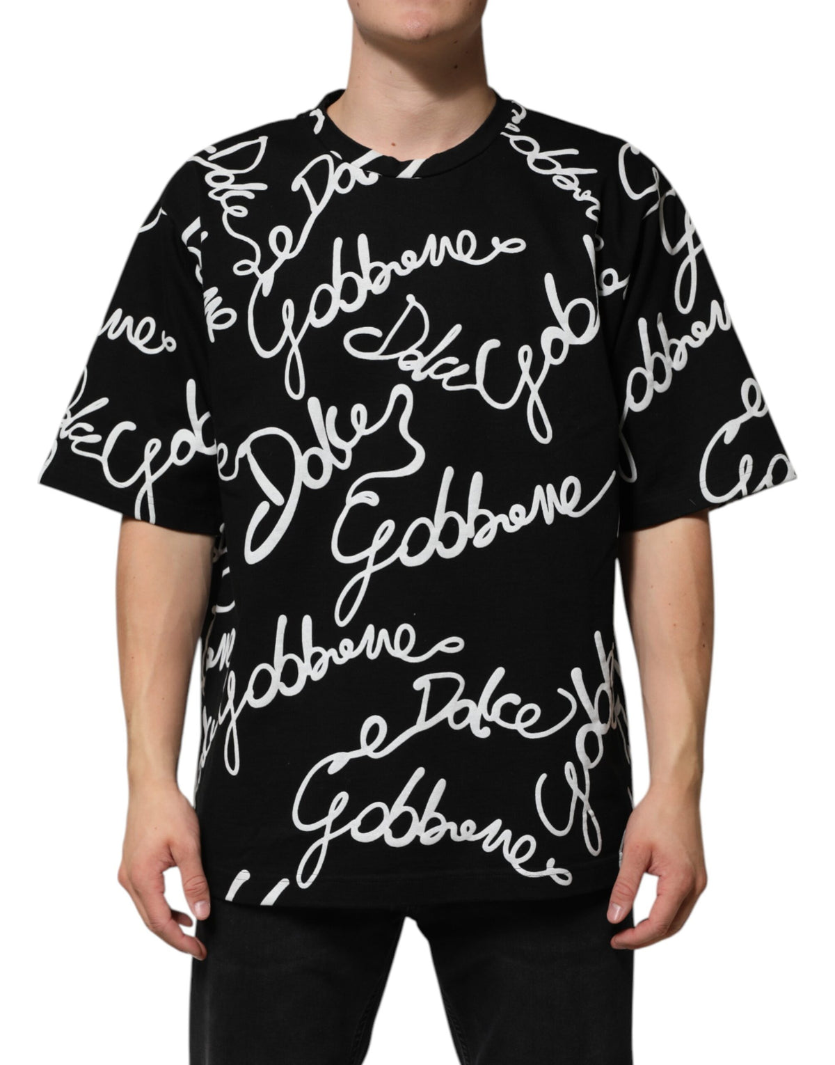 Indulge in the Dolce & Gabbana Black Logo Print Cotton Crew Neck T-shirt, a masterpiece of Italian craftsmanship that exudes timeless elegance and effortless sophistication.