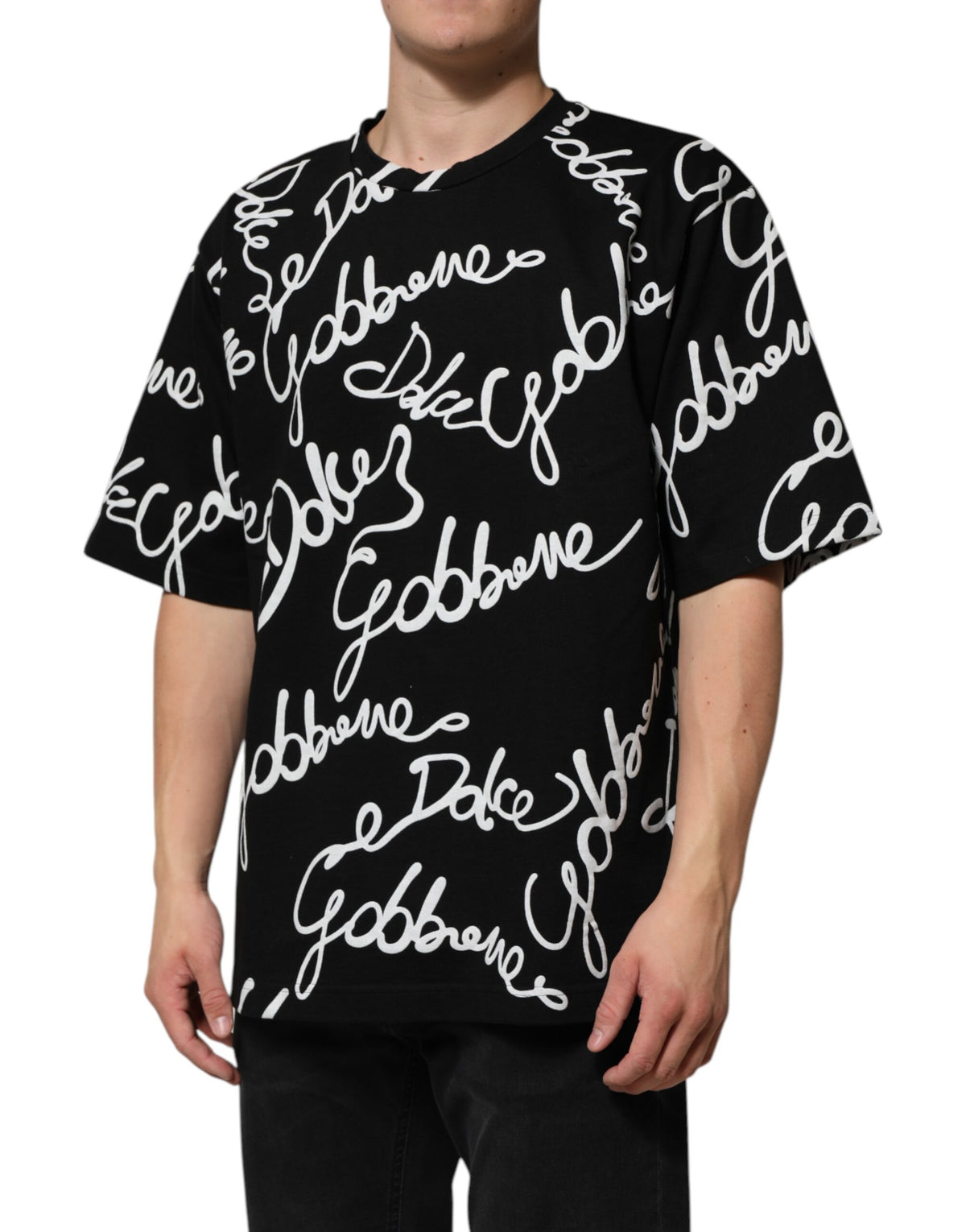 Indulge in the Dolce & Gabbana Black Logo Print Cotton Crew Neck T-shirt, a masterpiece of Italian craftsmanship that exudes timeless elegance and sophisticated allure.