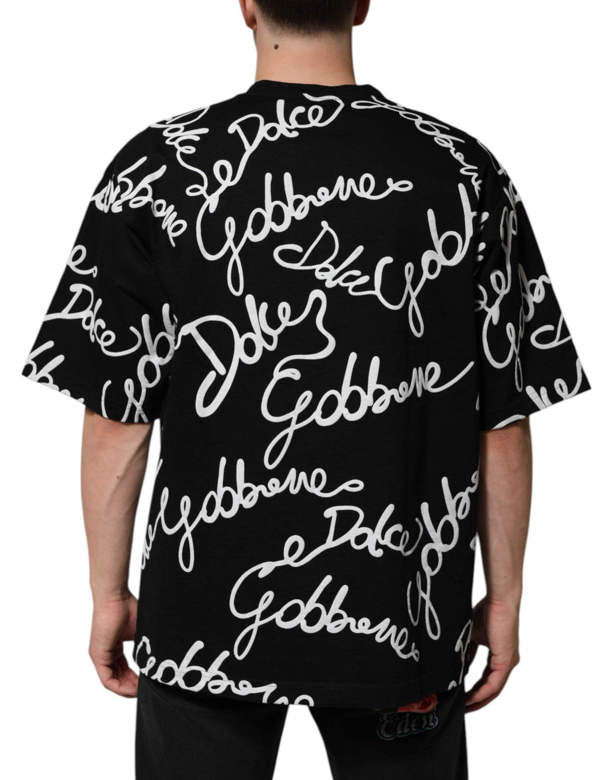 Indulge in the luxurious Dolce & Gabbana Black Logo Print Cotton Crew Neck T-shirt, a timeless piece that embodies sophistication and elevates your style with effortless elegance.