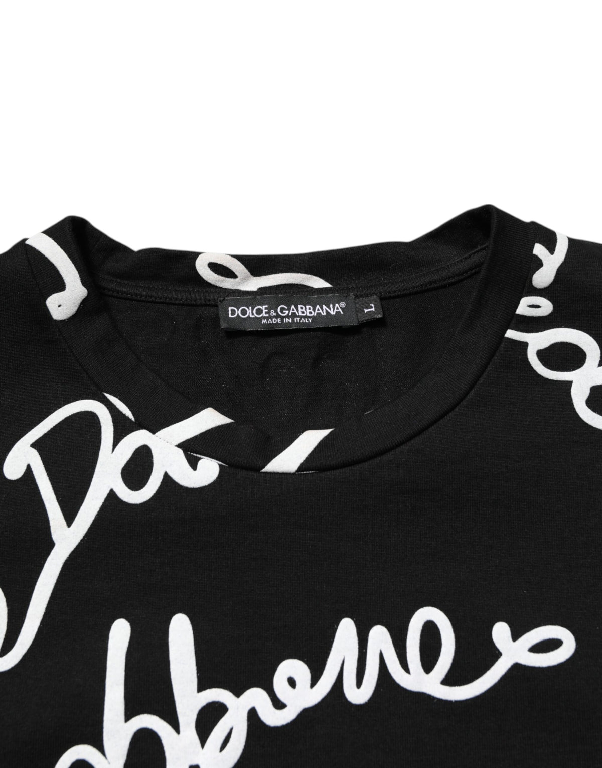 Indulge in the Dolce & Gabbana Black Logo Print Cotton Crew Neck T-shirt, a symbol of timeless elegance and Italian craftsmanship that elevates your style with luxurious sophistication.