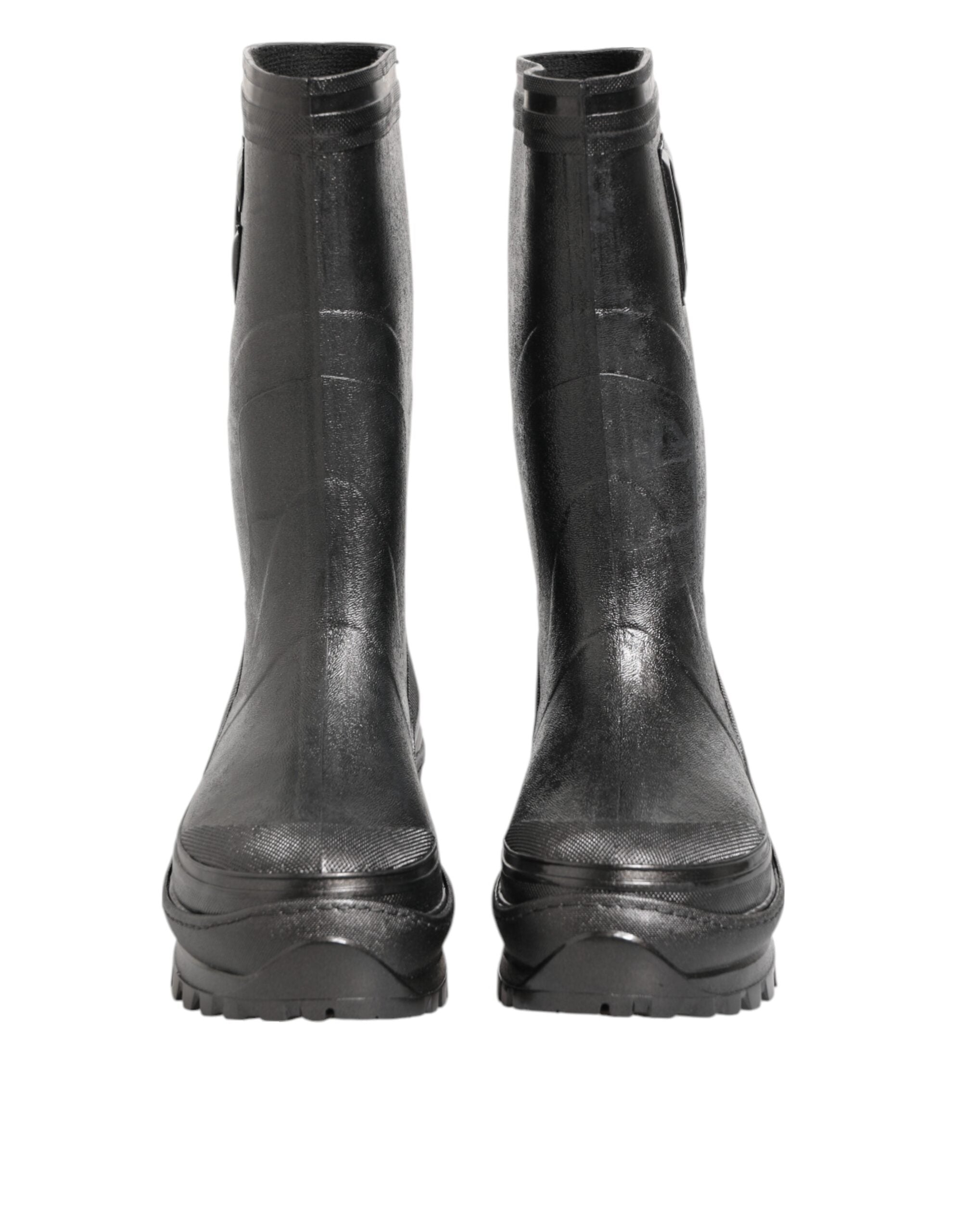 Elevate your style with Dolce & Gabbana's Metallic Black Pull On Rain Boots, crafted from luxurious PVC and leather, embodying sophistication and timeless elegance.