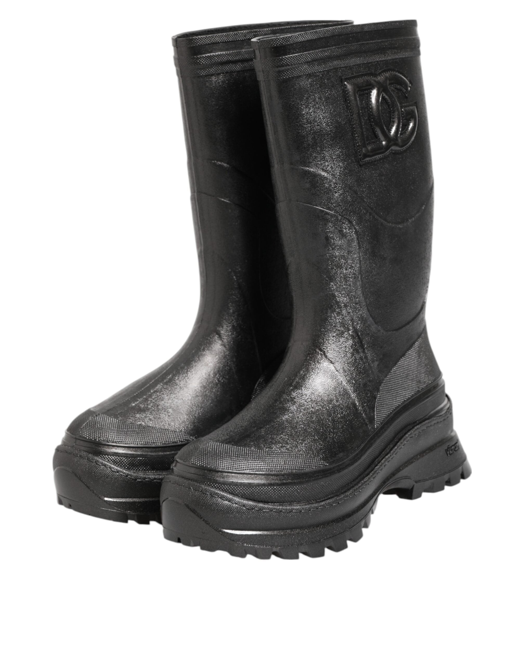 Elevate your rainy-day elegance with Dolce & Gabbana's Metallic Black Pull On Rain Boots, crafted from luxurious PVC and leather for a sophisticated, timeless allure.