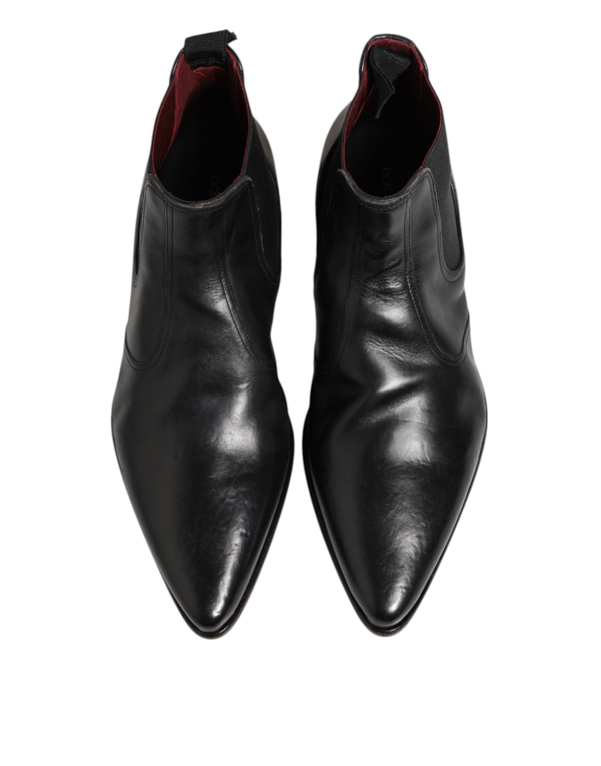 Experience the allure of Dolce & Gabbana Black Chelsea Slip On Ankle Boots, crafted from premium calf leather, embodying timeless elegance and exquisite Italian craftsmanship.