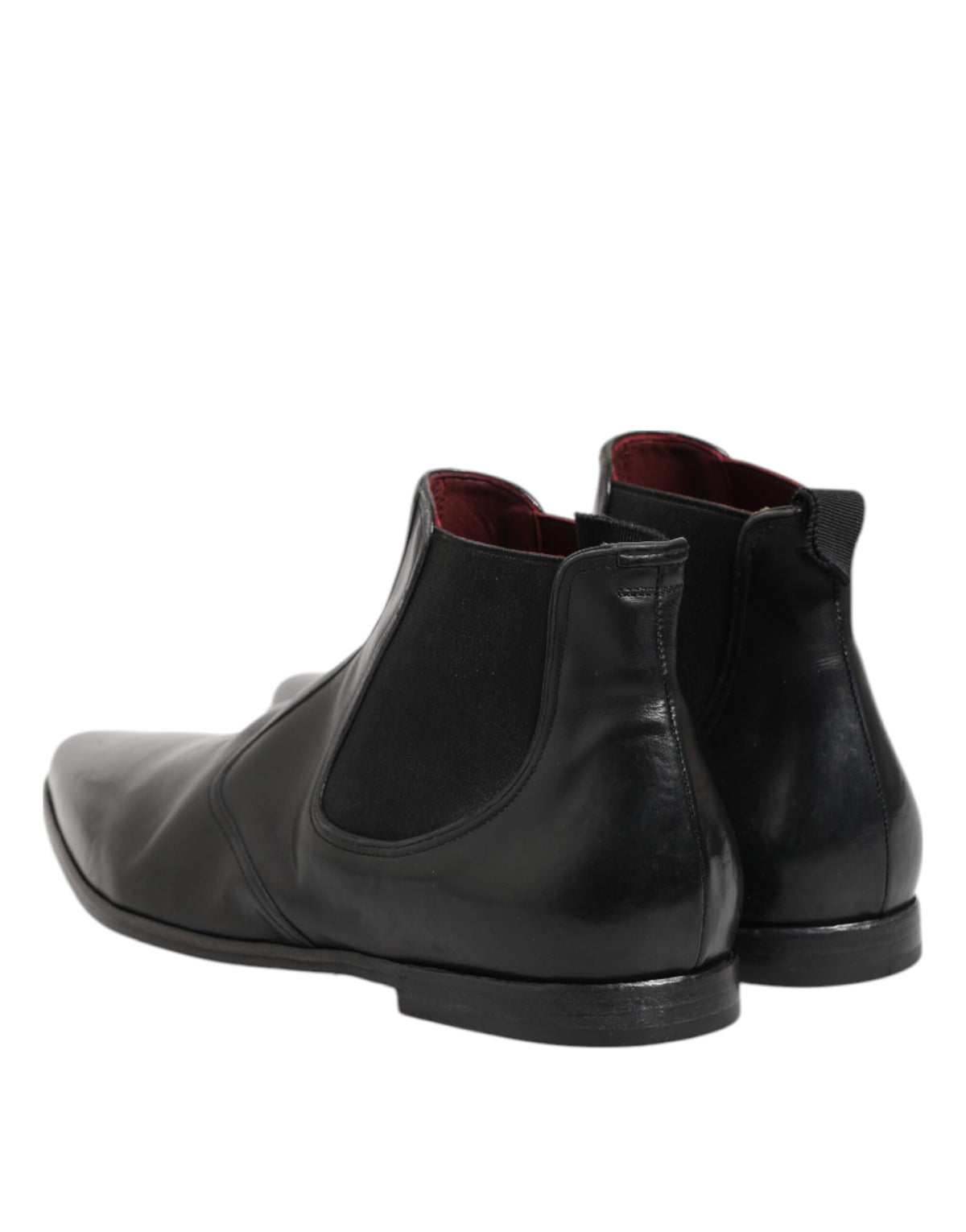 Elevate your style with Dolce & Gabbana's Black Chelsea Slip On Boots, crafted from premium calf leather for timeless elegance and unmatched sophistication.