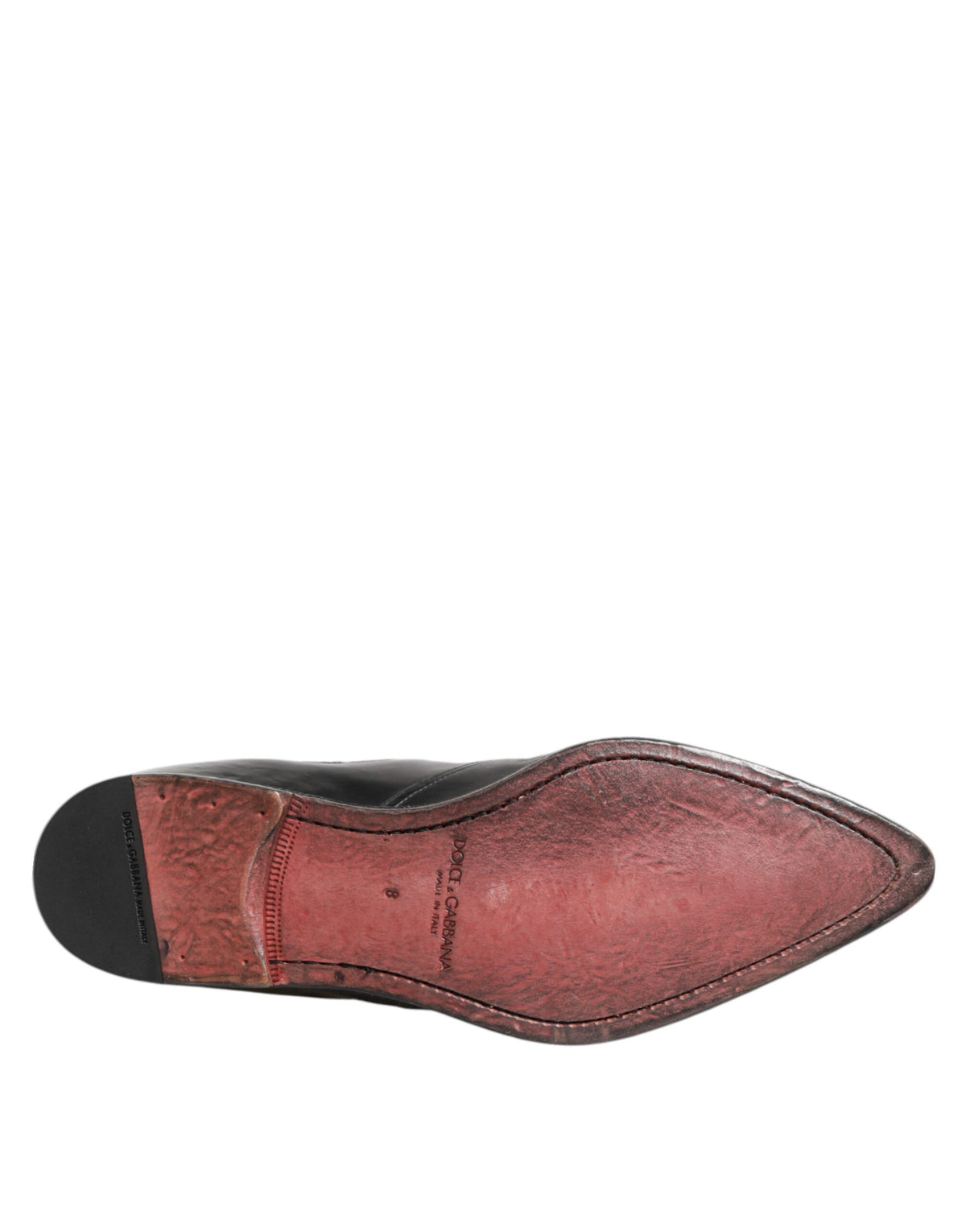 Indulge in the exquisite craftsmanship of Dolce & Gabbana Black Chelsea Slip On Boots, crafted from premium calf leather for timeless elegance and refined allure.