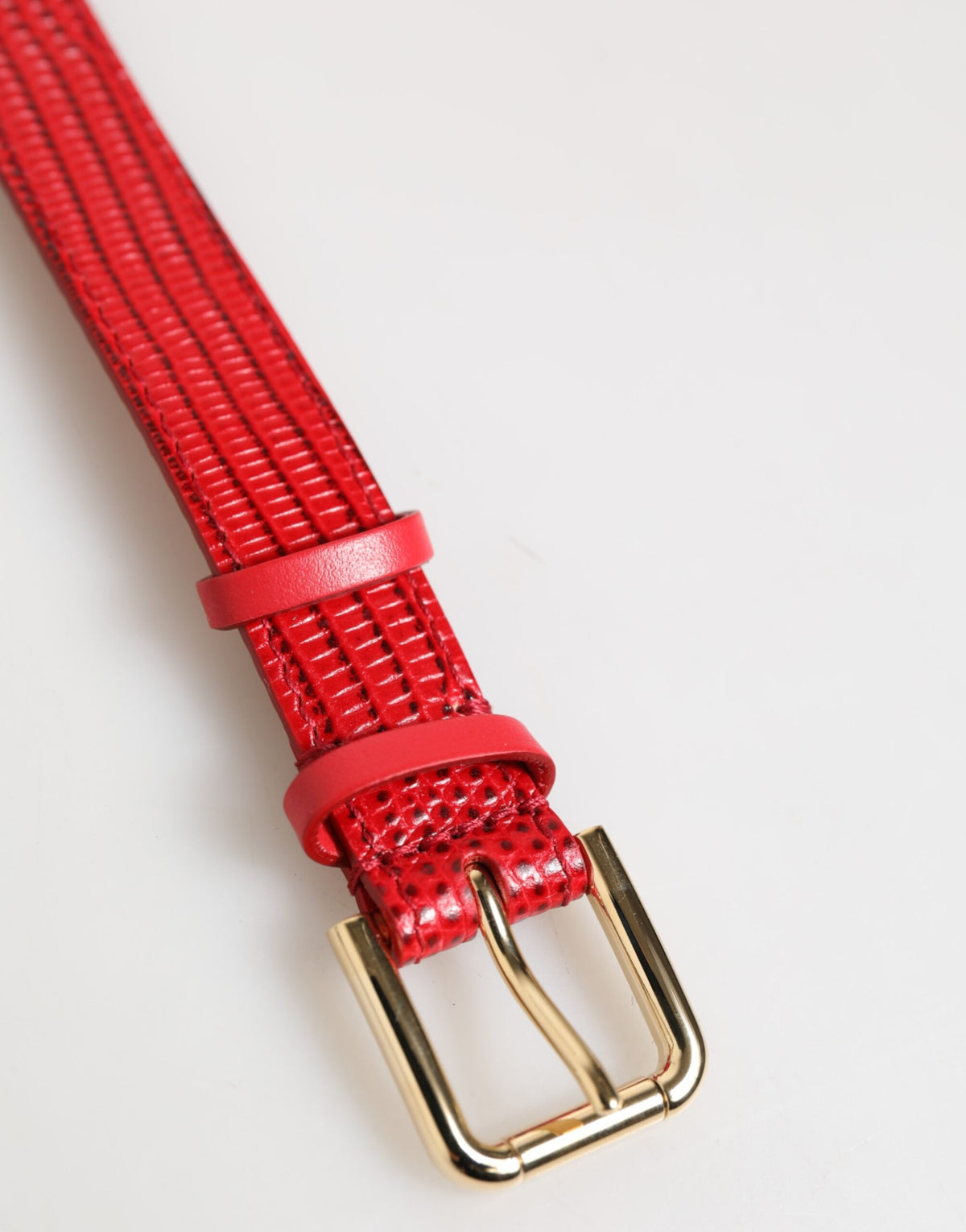 Indulge in the opulence of the Dolce & Gabbana Red Exotic Leather Armband, a testament to Italian craftsmanship that elevates your elegance and sophistication.