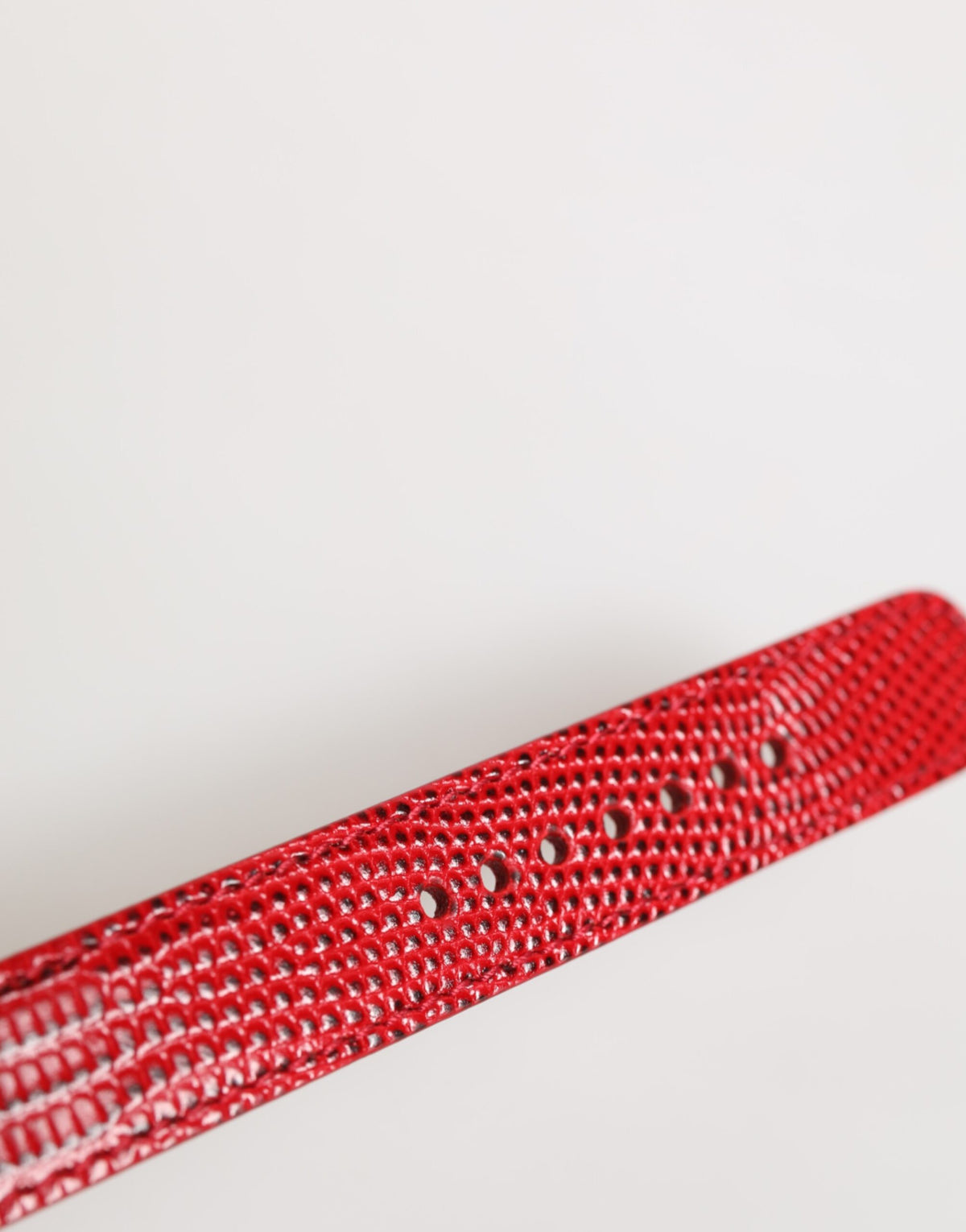 Indulge in the opulence of the Dolce & Gabbana Red Exotic Leather Armband, a masterclass in Italian craftsmanship that elevates your style with passion and sophistication.