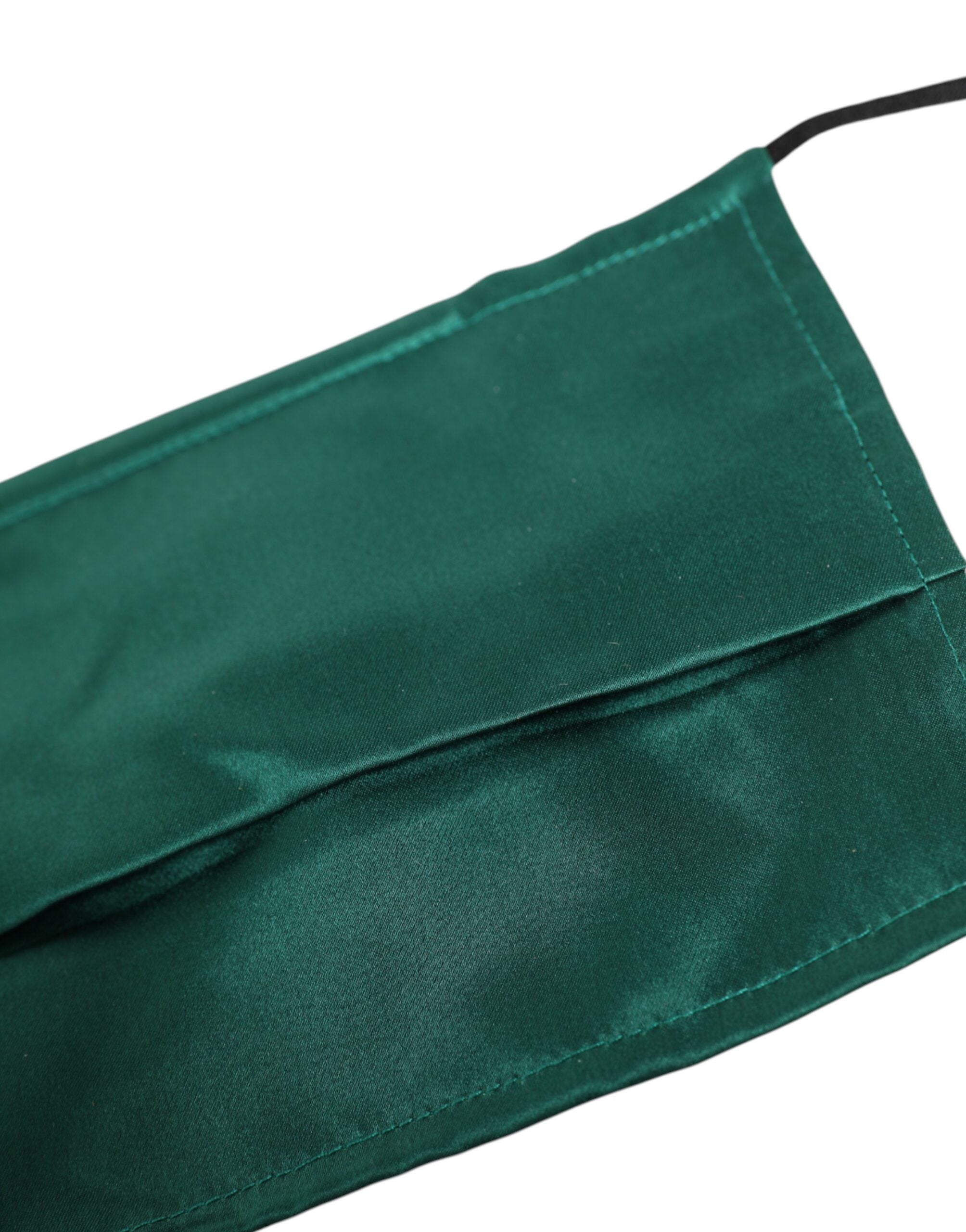 Indulge in the Dolce & Gabbana Green Silk Pleated Face Mask, a symbol of Italian elegance and artistry, elevating your style with luxurious sophistication.