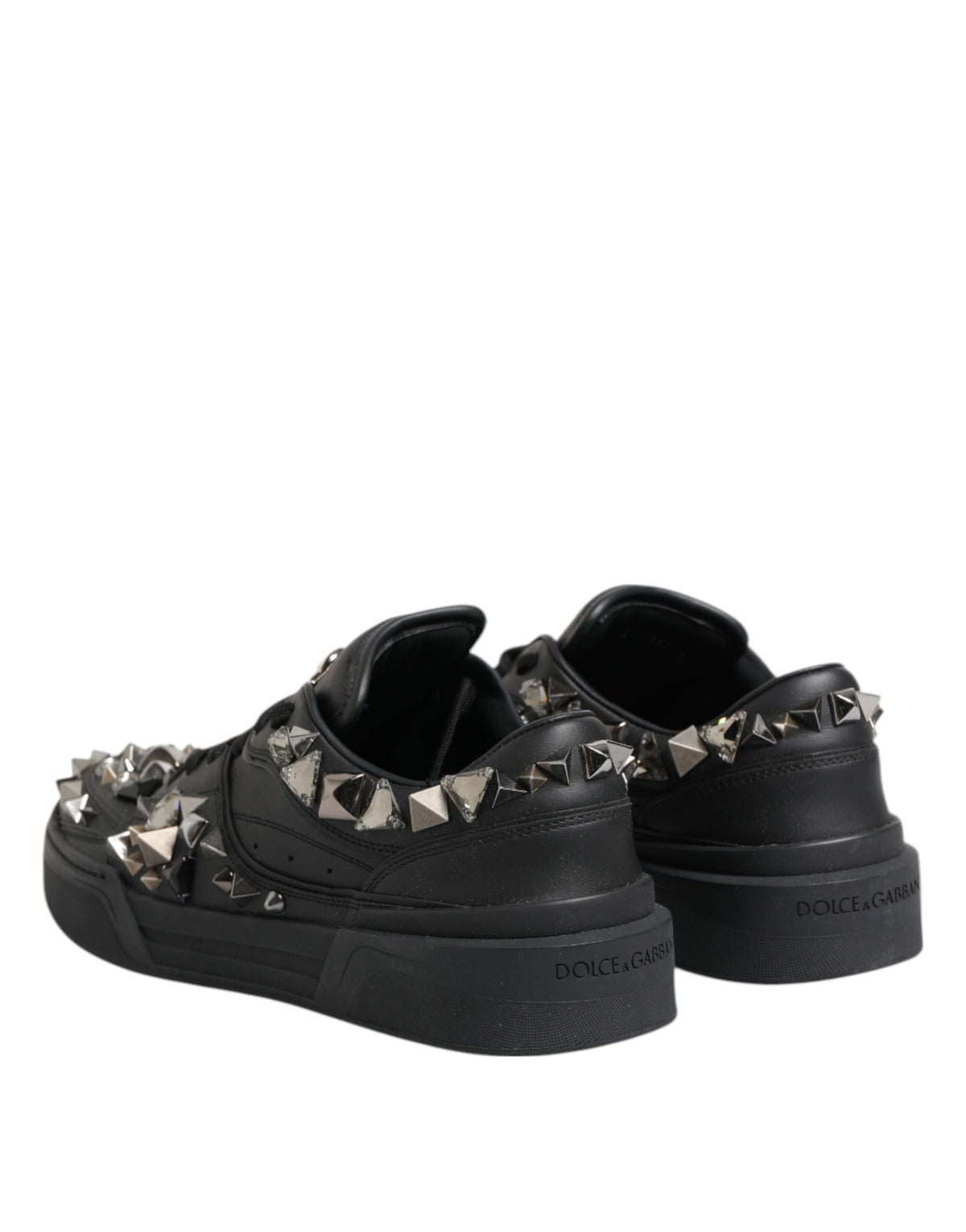 Indulge in the exquisite Dolce & Gabbana Black Leather Studded Low Top Sneakers, crafted from premium calf leather for a luxurious blend of elegance and individuality.
