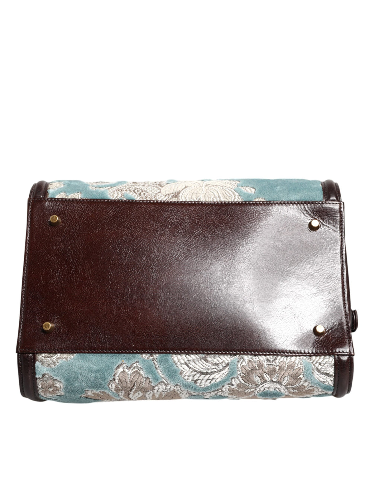 Discover the Dolce & Gabbana Blue Brown Leather Floral Jacquard Travel Handbag, a masterpiece of premium leather and velvet, embodying elegance and sophistication for every journey.