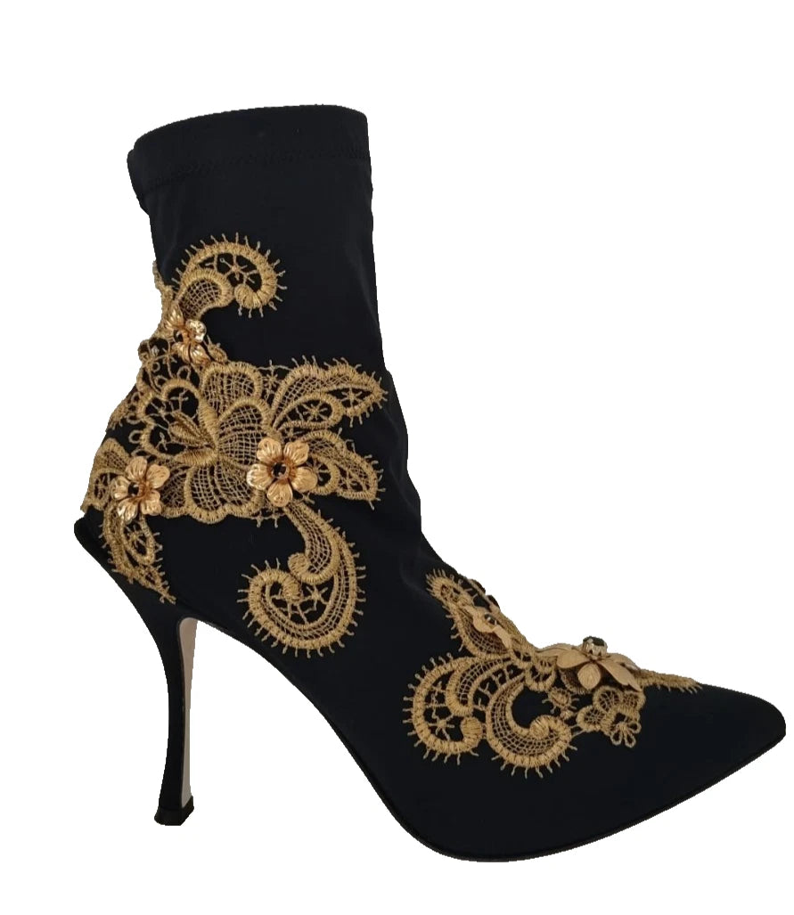 Experience the allure of Dolce & Gabbana's Black Gold Embroidery Crystal Boots, where exquisite craftsmanship meets timeless elegance, perfect for the discerning fashion connoisseur.