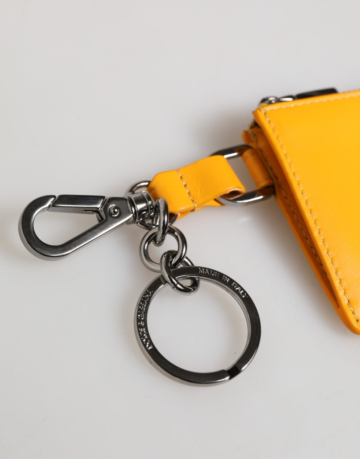 Elevate your style with the Dolce & Gabbana Yellow Orange Leather Credit Card Key Holder Wallet, a masterpiece of Italian craftsmanship in luxurious calf leather, perfect for the discerning individual.