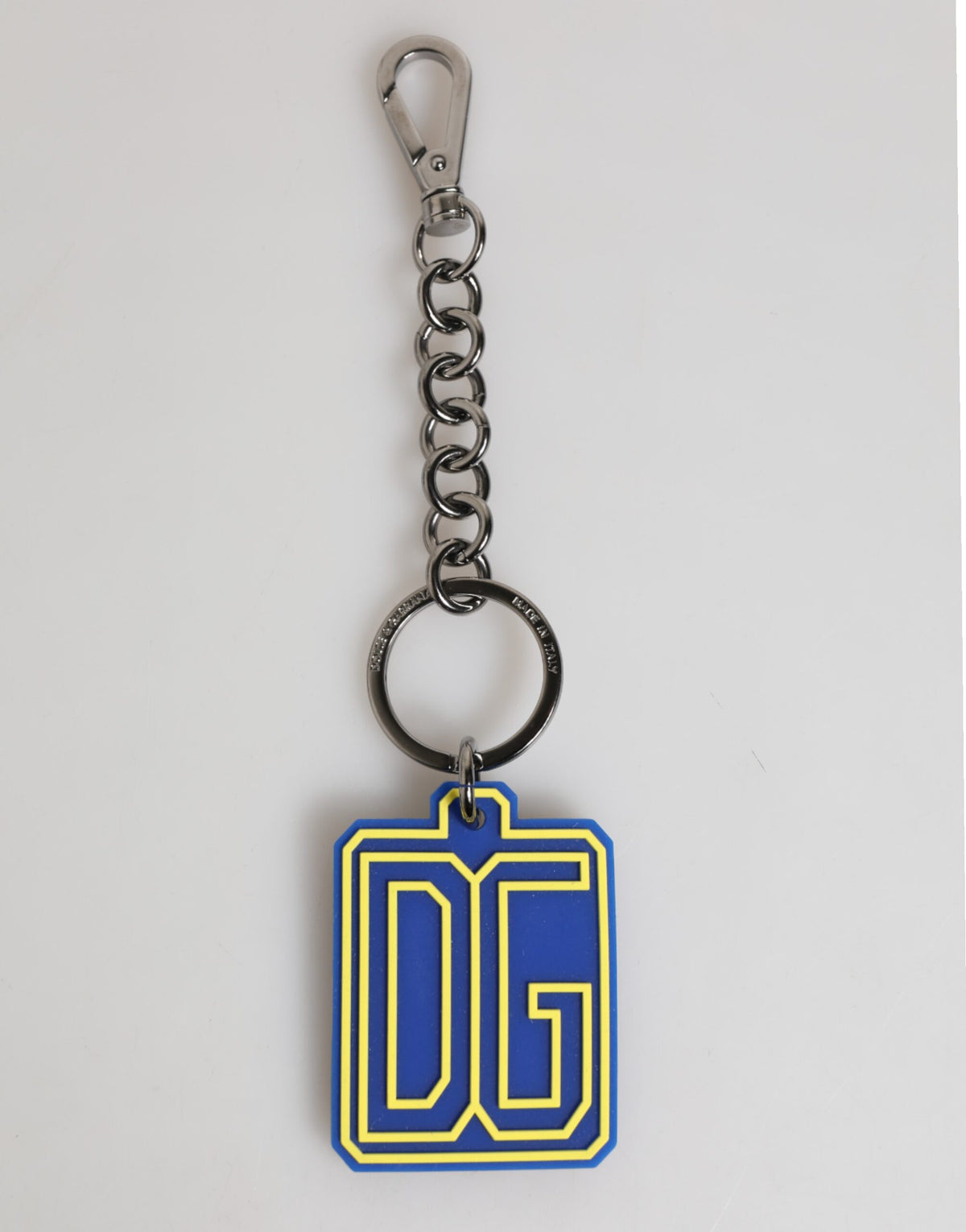 Elevate your style with the Dolce & Gabbana Blue Yellow DG Rubber Logo Silver Keychain, a luxurious accessory crafted in Italy, embodying refined sophistication and artistry.