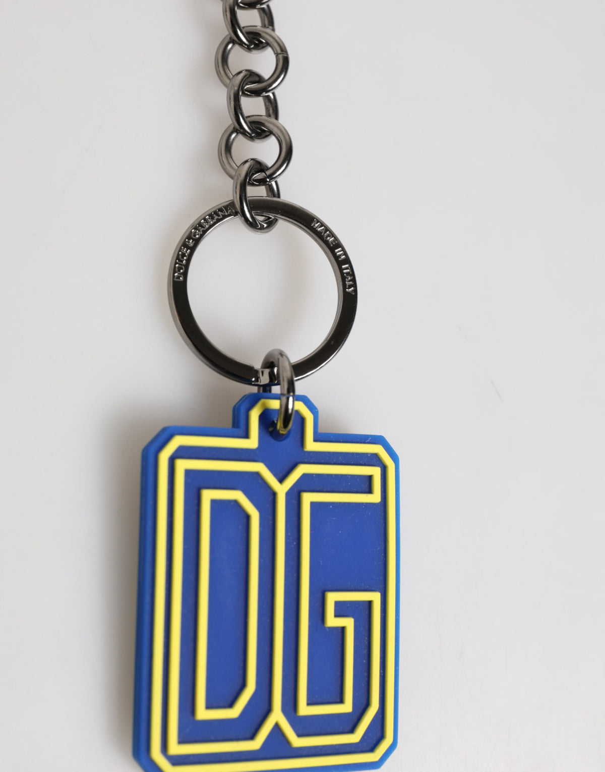Elevate your style with the Dolce & Gabbana DG Rubber Logo Silver Keychain, a luxurious blend of artistry and sophistication, crafted in Italy for the discerning individual.