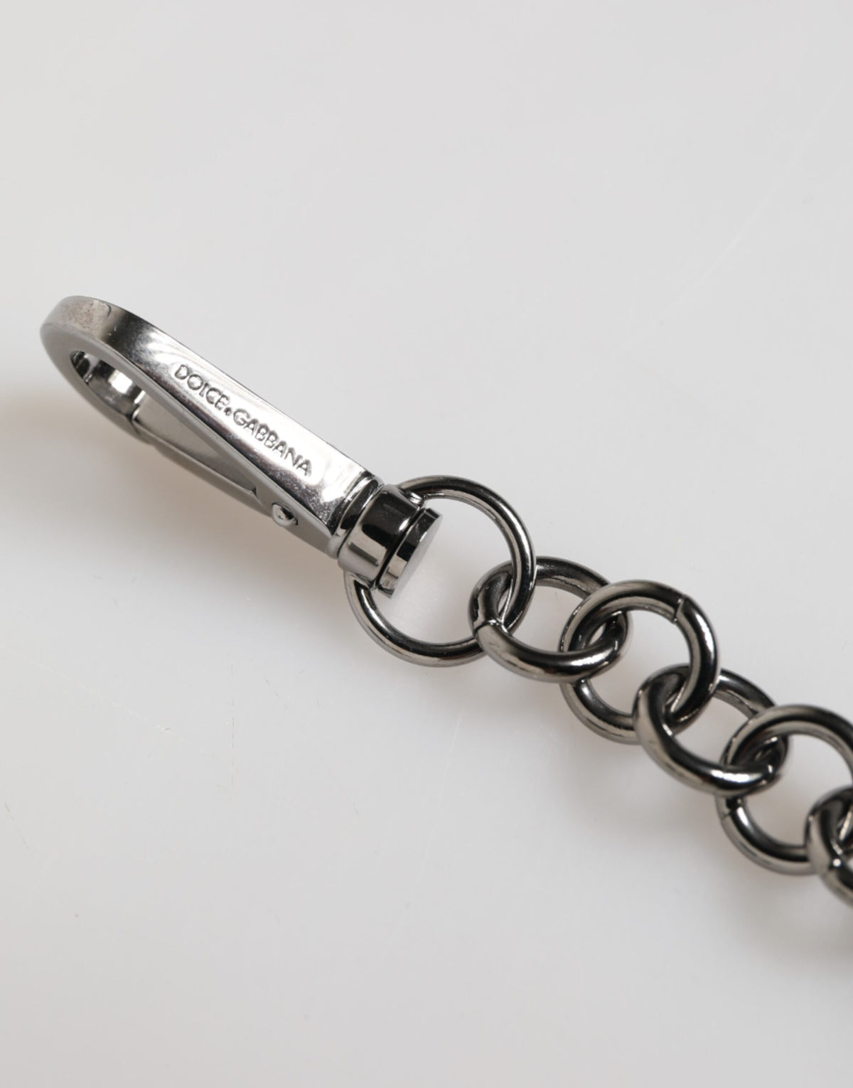 Elevate your style with the Dolce & Gabbana Blue Yellow DG Rubber Logo Silver Keychain, a luxurious accessory crafted in Italy, embodying refined sophistication and artistry.