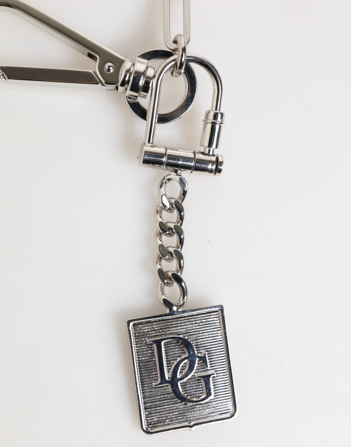 Elevate your style with the Dolce & Gabbana Silver Tone Metal Chain DG Logo Pendant Necklace, a masterpiece of Italian craftsmanship blending Zamak and brass for timeless allure.