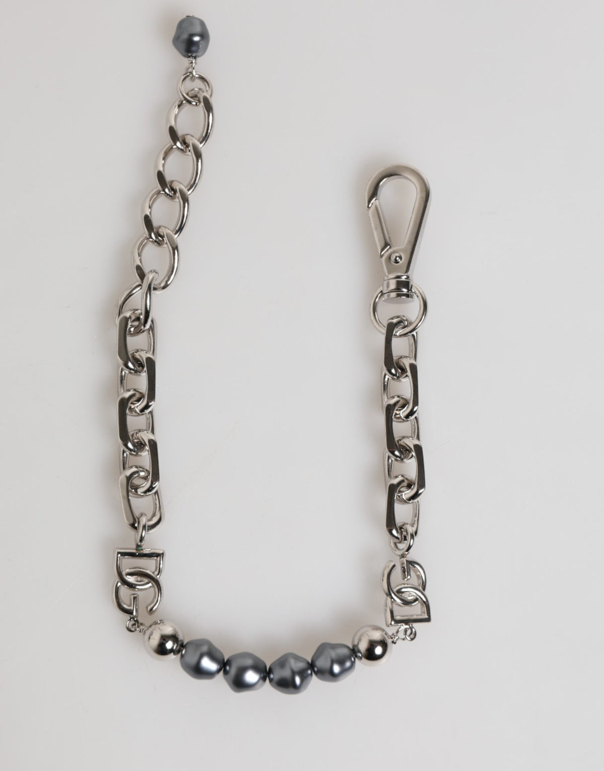 Indulge in the exquisite Dolce & Gabbana Silver Tone Chain Lobster Clasp Logo Gray Pearls Bracelet, a luxurious statement piece that embodies timeless elegance and sophistication.