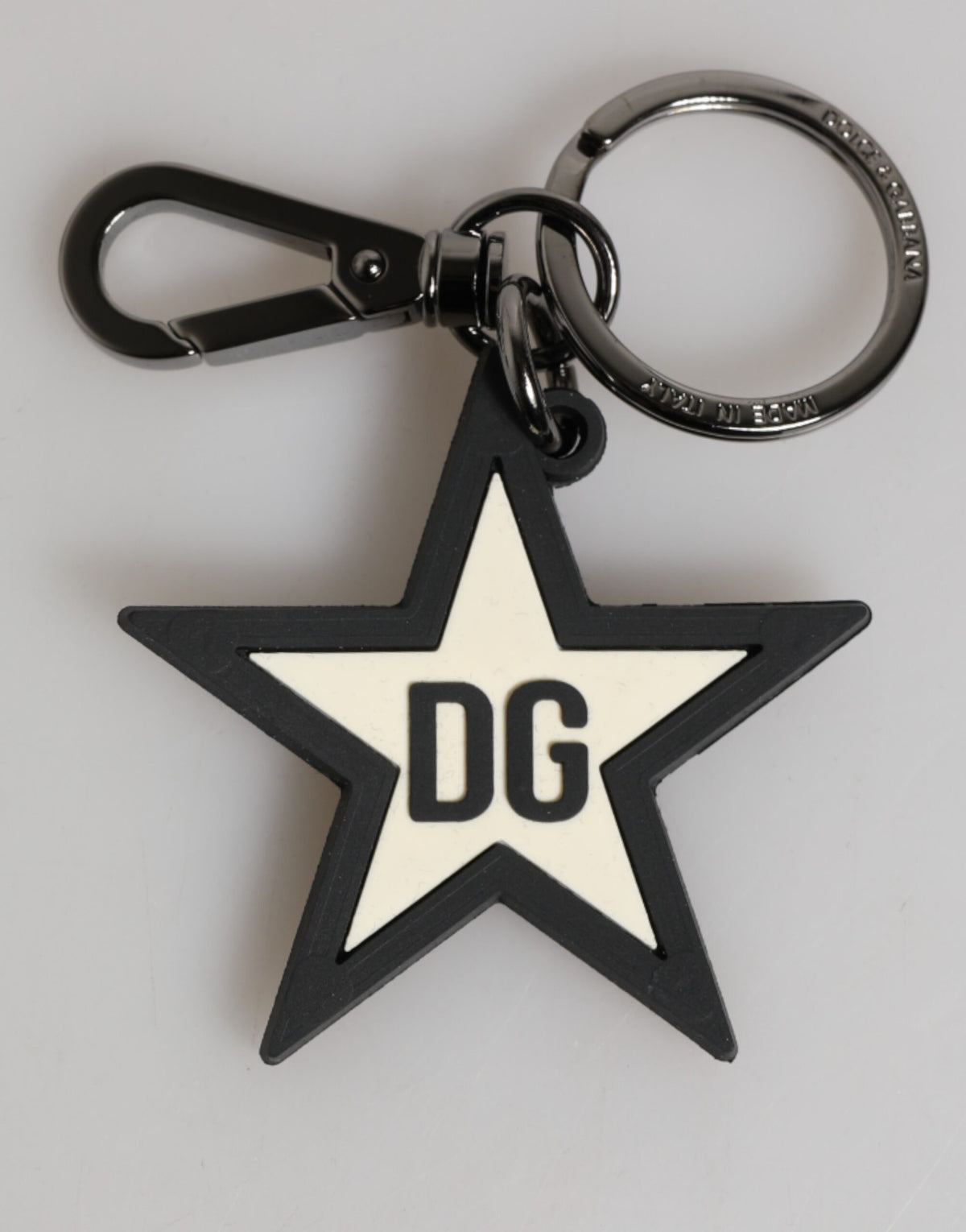 Elevate your style with the Dolce & Gabbana DG Logo Star Rubber Keychain, a luxurious blend of exquisite craftsmanship and iconic design, perfect for the discerning individual.