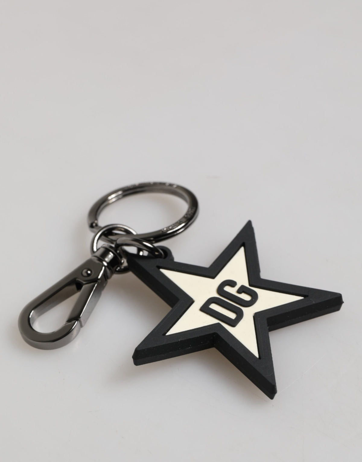Elevate your style with the Dolce & Gabbana DG Logo Star Rubber Keychain, a masterpiece of Italian craftsmanship that embodies luxury and sophistication for the discerning individual.