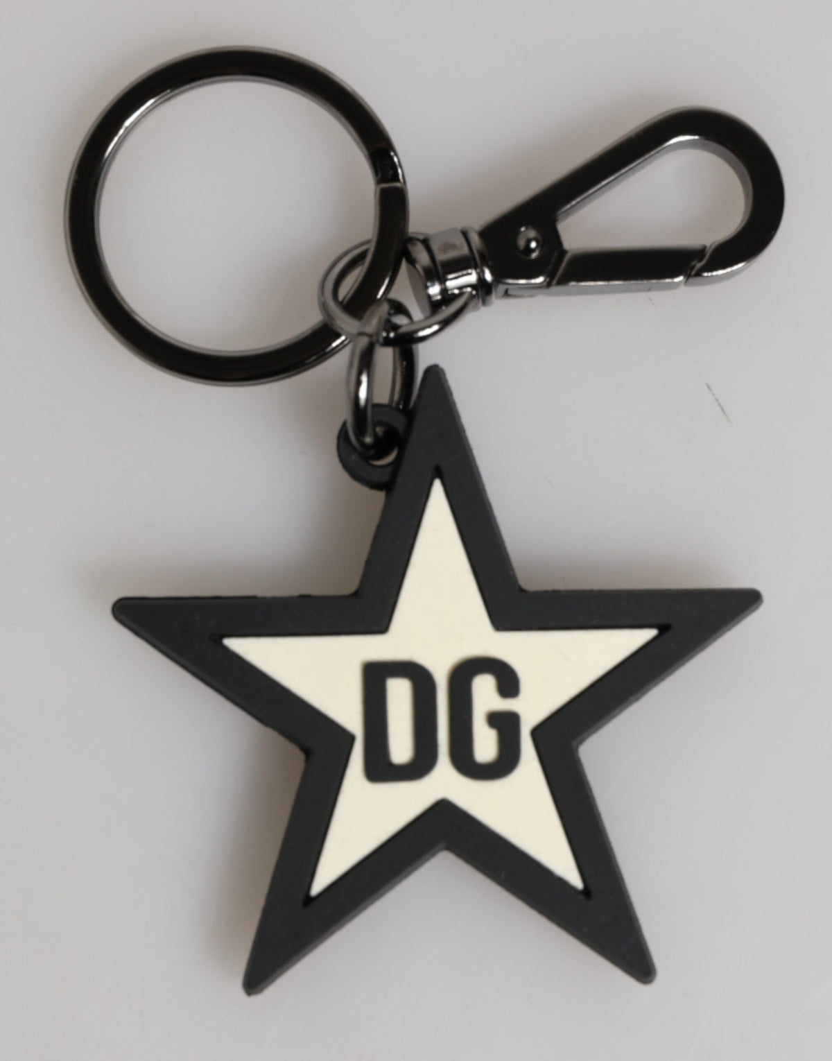 Elevate your style with the Dolce & Gabbana DG Logo Star Rubber Keychain, a luxurious blend of artisanal craftsmanship and timeless elegance, perfect for discerning tastes.