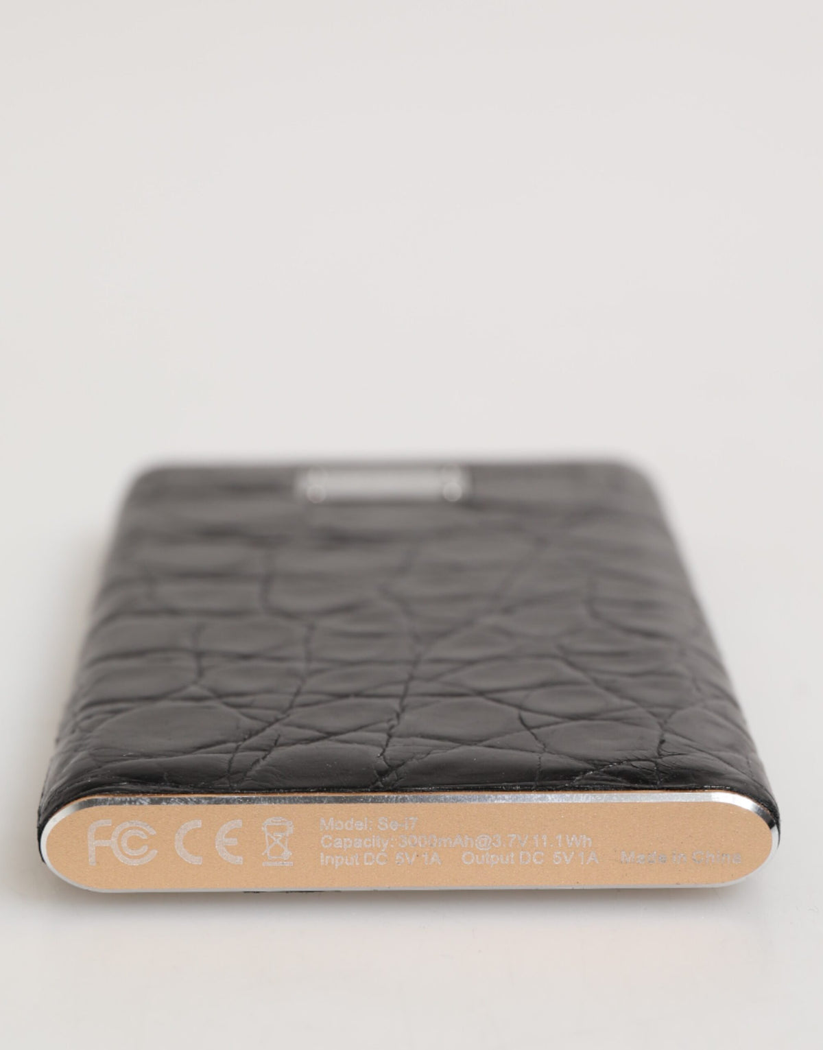 Indulge in the exquisite Dolce & Gabbana Black Exotic Leather Embossed Power Bank, where luxurious craftsmanship meets essential functionality for the discerning individual.