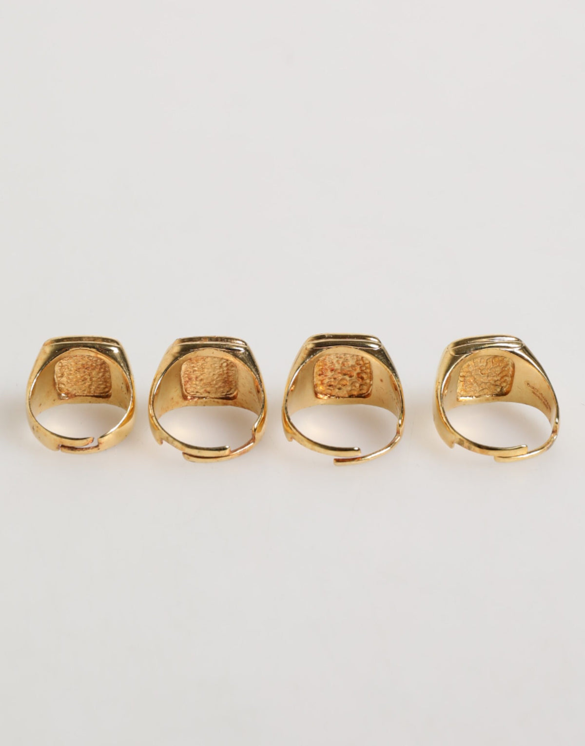 Experience the allure of Dolce & Gabbana's Gold Tone Brass JAZZ Letter Set, a luxurious fusion of silver and enamel, crafted for those who embody elegance and individuality.