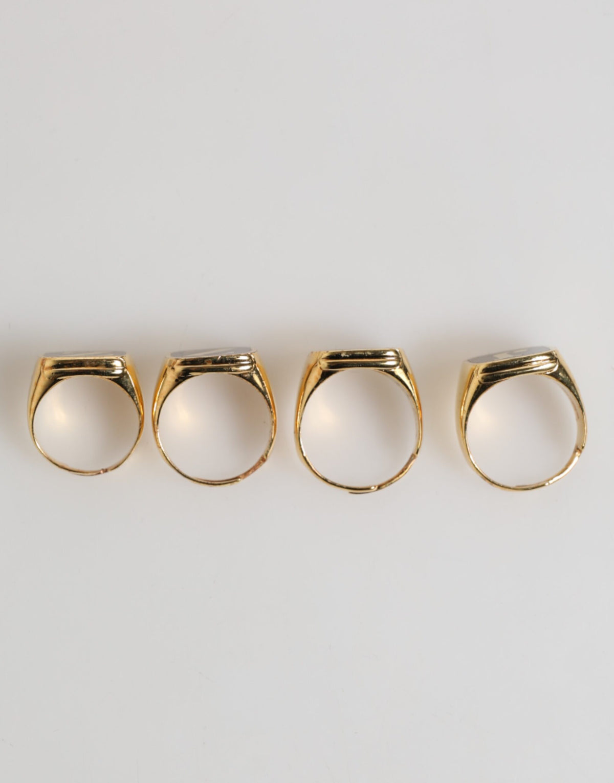 Discover the exquisite Dolce & Gabbana Gold Tone Brass JAZZ Letter Set, a luxurious blend of silver and enamel, embodying sophistication and artistic flair for the discerning individual.