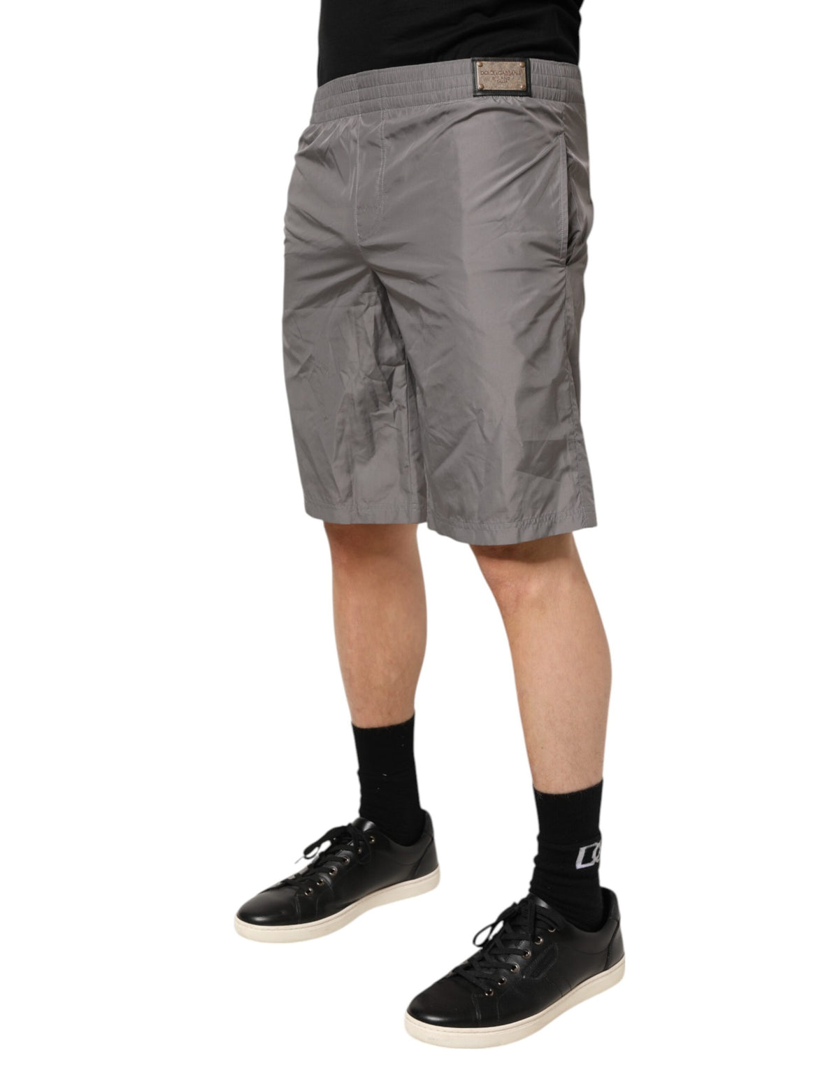 Elevate your beachside allure with Dolce & Gabbana's Light Gray Nylon Elastic Waist Shorts, crafted in Italy for the discerning individual who embodies elegance and sophistication.