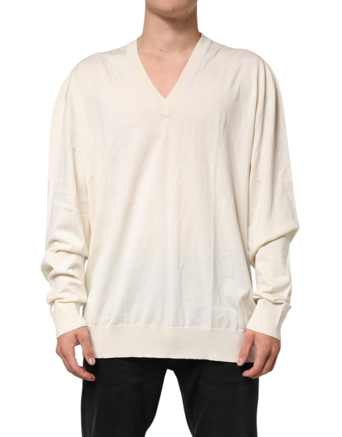 Elevate your wardrobe with the Dolce & Gabbana Ivory Virgin Wool V-Neck Knit Sweater, a luxurious blend of 70% virgin wool and 30% silk, crafted for timeless elegance.