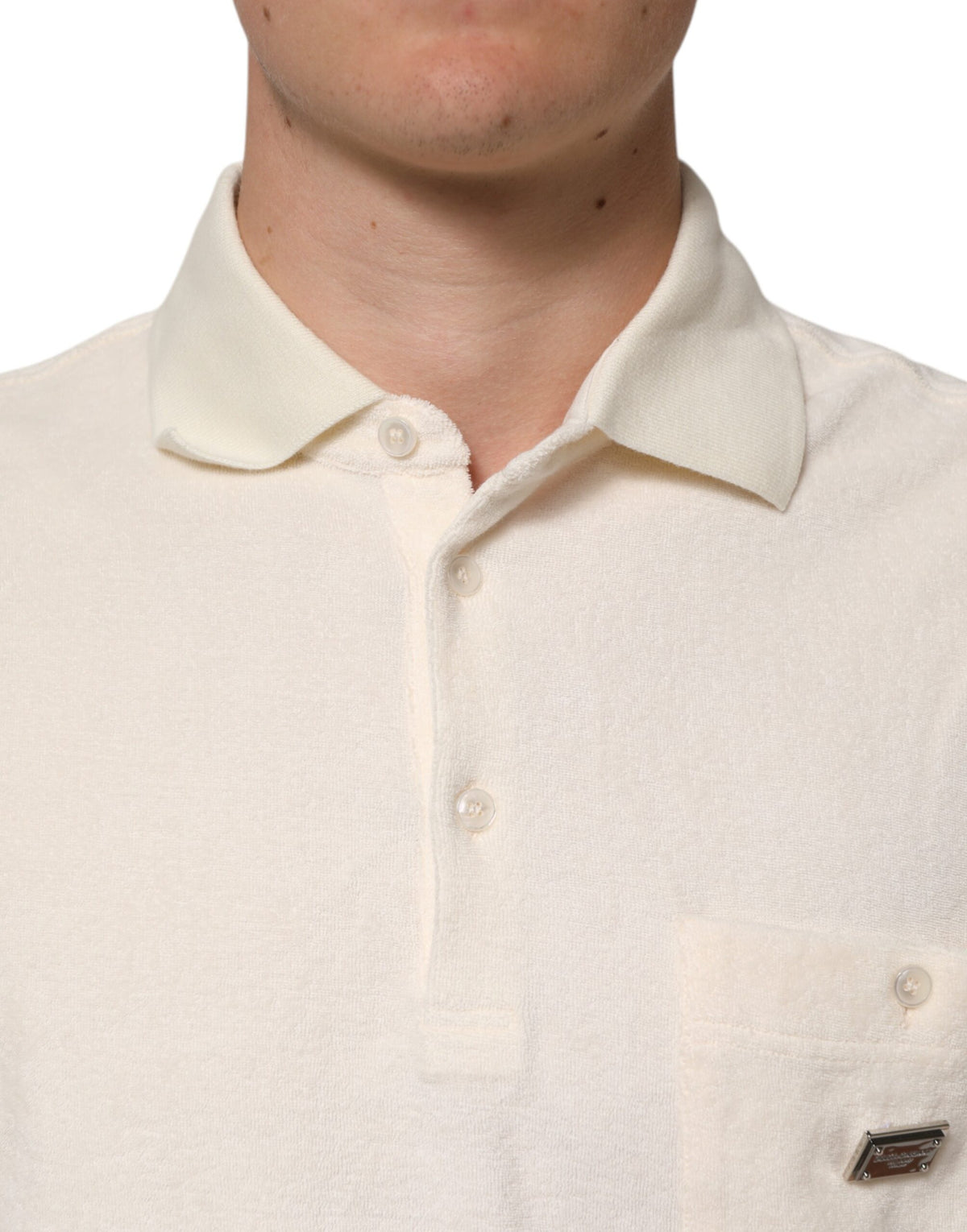 Discover the Dolce & Gabbana Ivory Cotton Terry Logo Pocket Polo T-shirt, a masterpiece of Italian craftsmanship that embodies luxurious elegance and timeless sophistication.