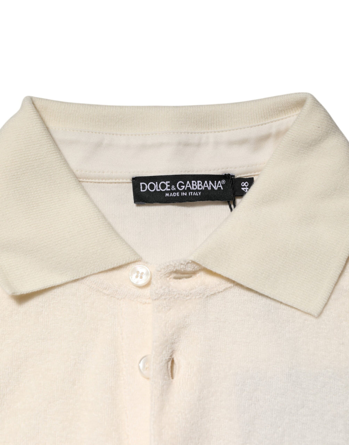 Indulge in the exquisite Dolce & Gabbana Ivory Cotton Terry Logo Pocket Polo T-shirt, where luxurious craftsmanship meets timeless elegance, perfect for the discerning individual.
