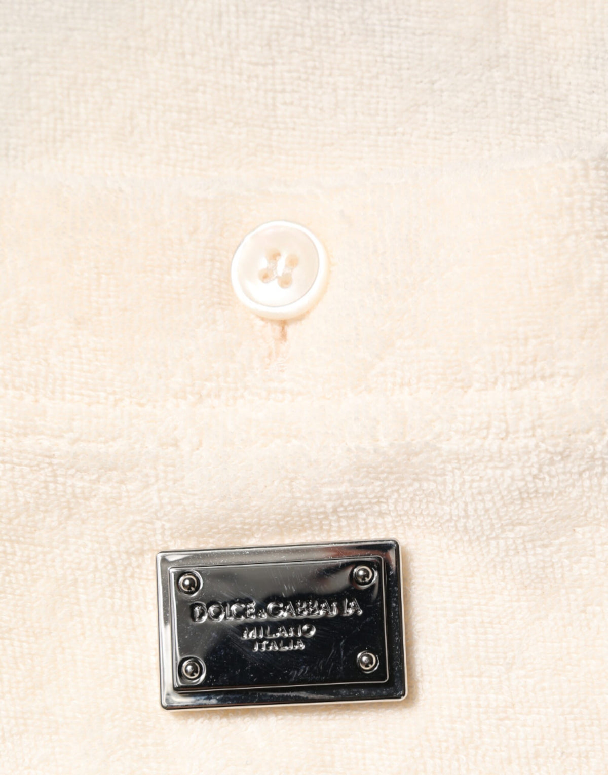 Indulge in the exquisite Dolce & Gabbana Ivory Cotton Terry Logo Pocket Polo T-shirt, a masterpiece of Italian craftsmanship that embodies timeless elegance and luxurious comfort.