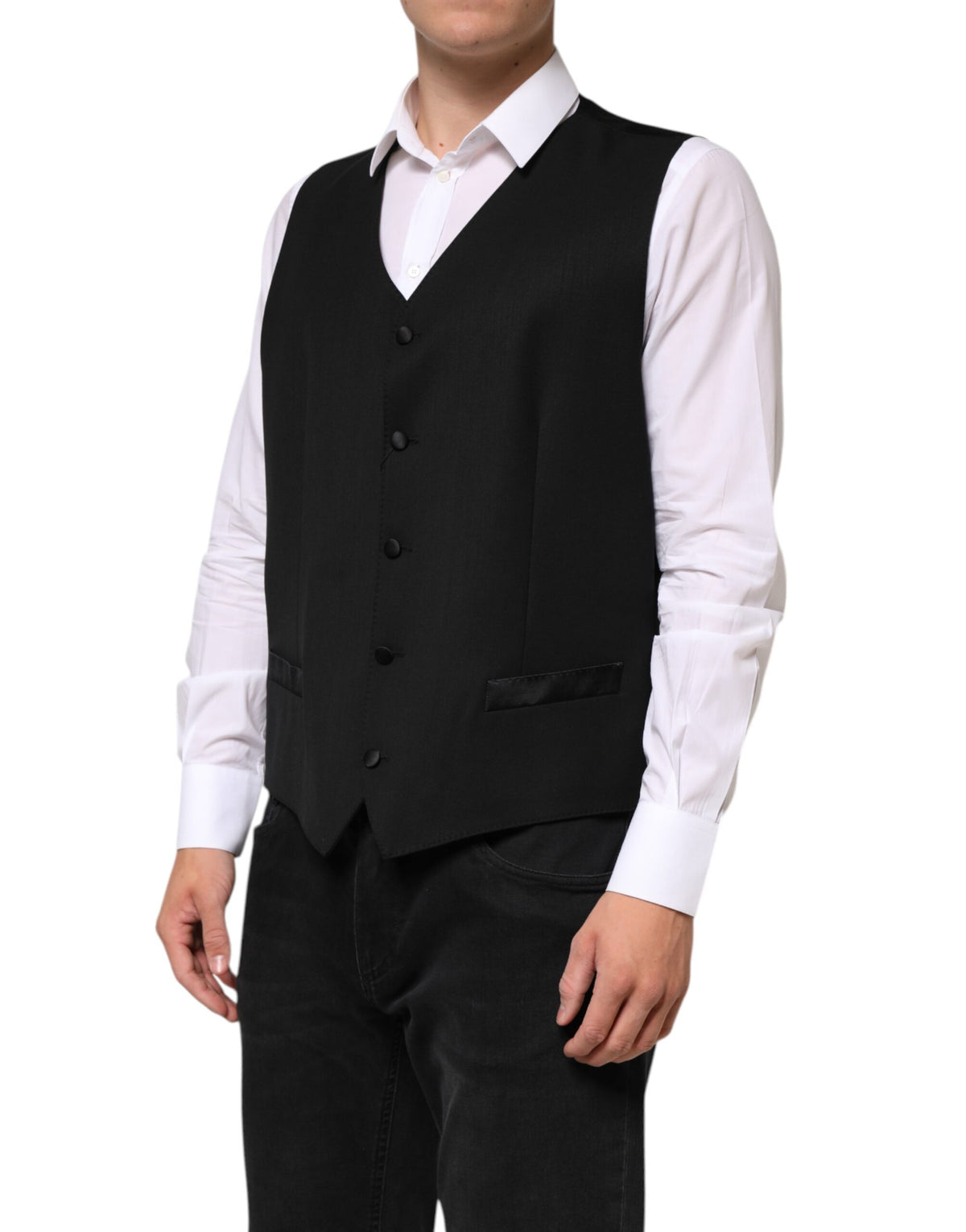 Elevate your elegance with the Dolce & Gabbana Black Wool Dress Formal Waistcoat Vest, a masterpiece of Italian craftsmanship blending luxurious wool and silk for timeless sophistication.