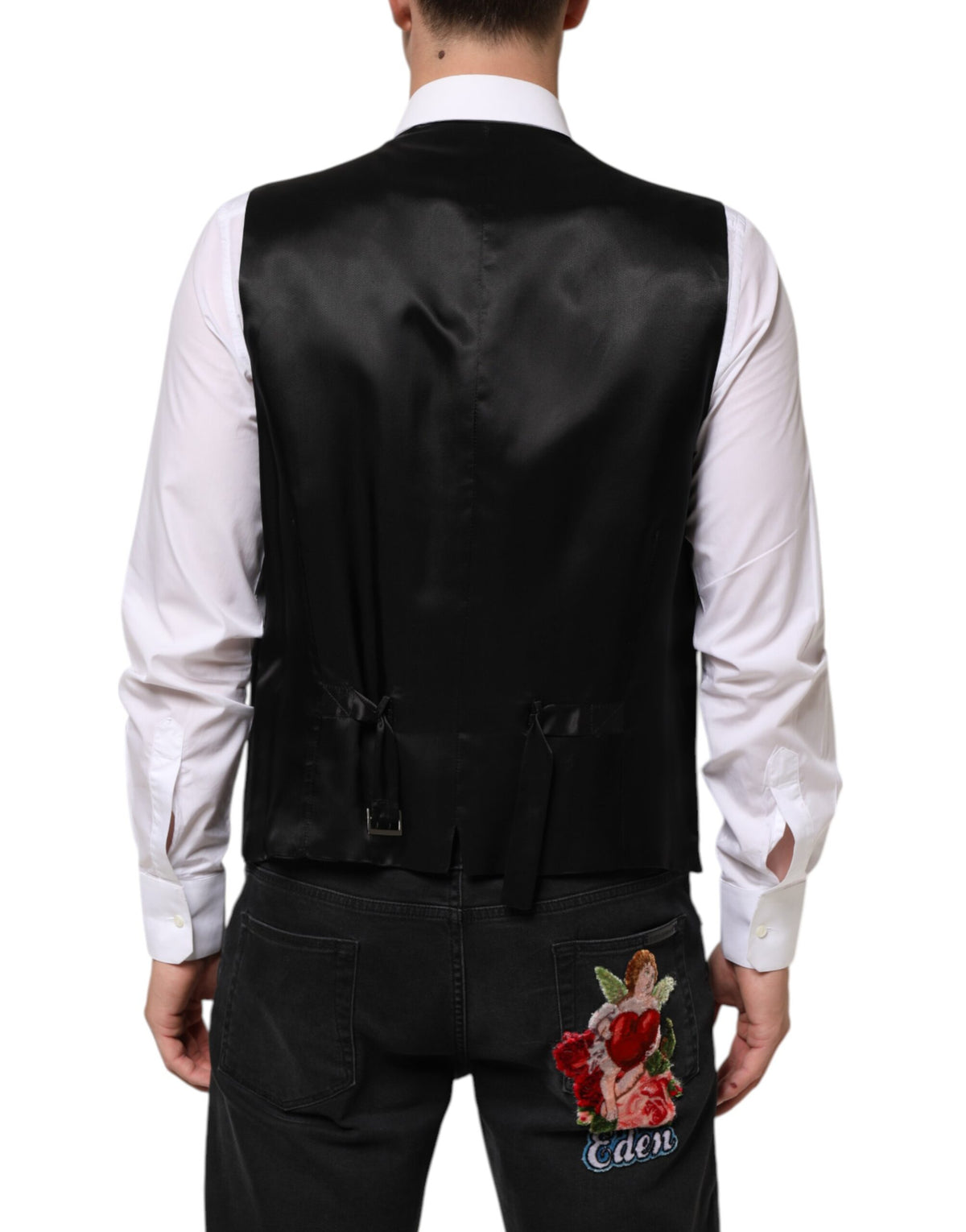 Elevate your formal attire with the Dolce & Gabbana Black Wool Dress Waistcoat Vest, a masterpiece of Italian craftsmanship blending luxurious wool and silk for timeless elegance.
