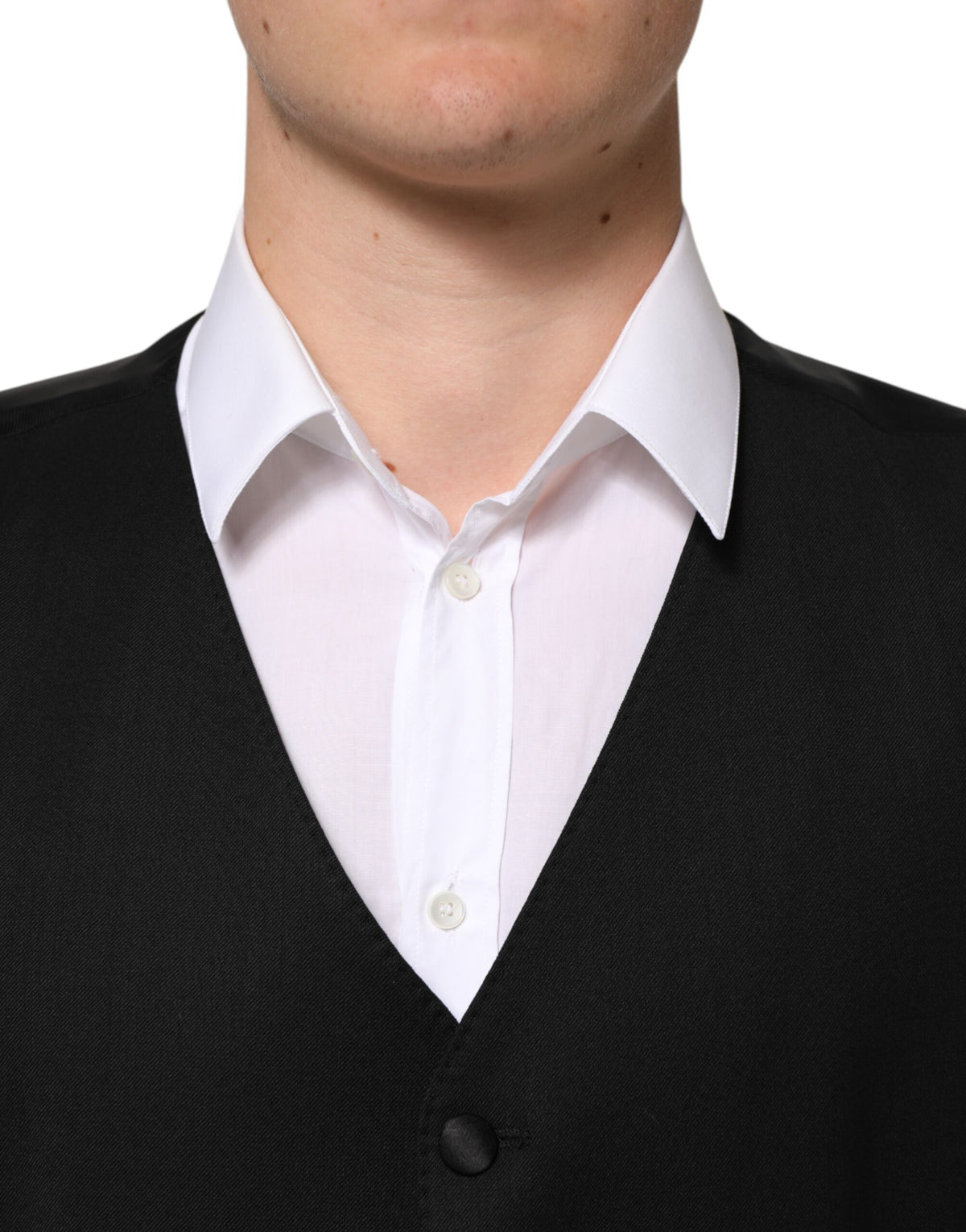 Elevate your elegance with the Dolce & Gabbana Black Wool Dress Waistcoat Vest, a masterpiece of Italian craftsmanship blending luxurious materials for timeless sophistication.