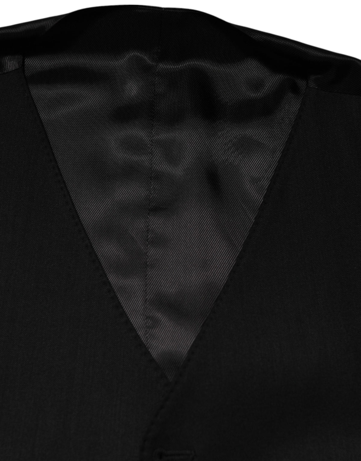 Elevate your wardrobe with the Dolce & Gabbana Black Wool Dress Formal Waistcoat Vest, a masterpiece of Italian craftsmanship and luxurious materials that embodies timeless elegance.