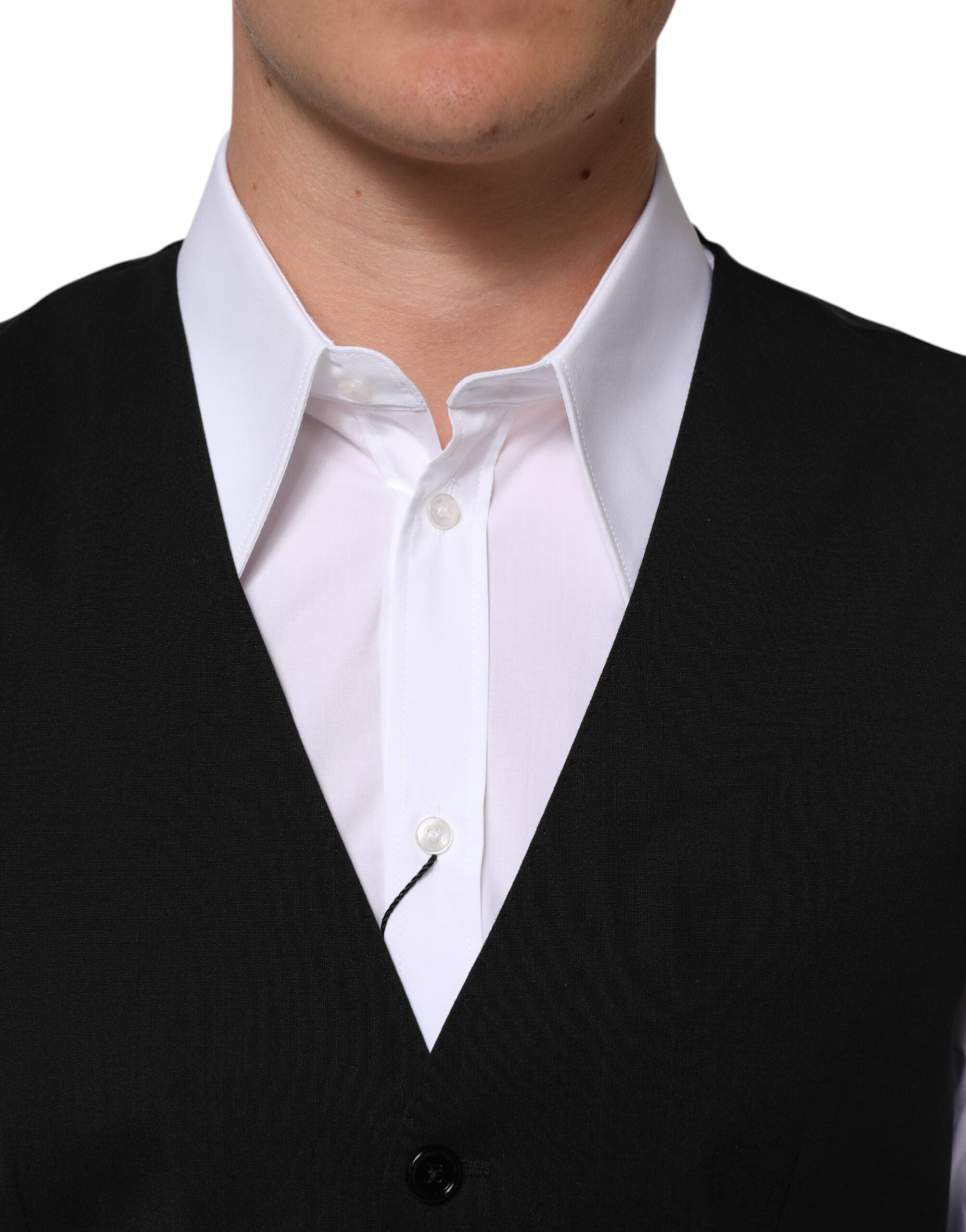 Elevate your wardrobe with the Dolce & Gabbana Black Wool Dress Waistcoat Vest, a masterpiece of Italian craftsmanship in luxurious virgin wool, perfect for any refined occasion.