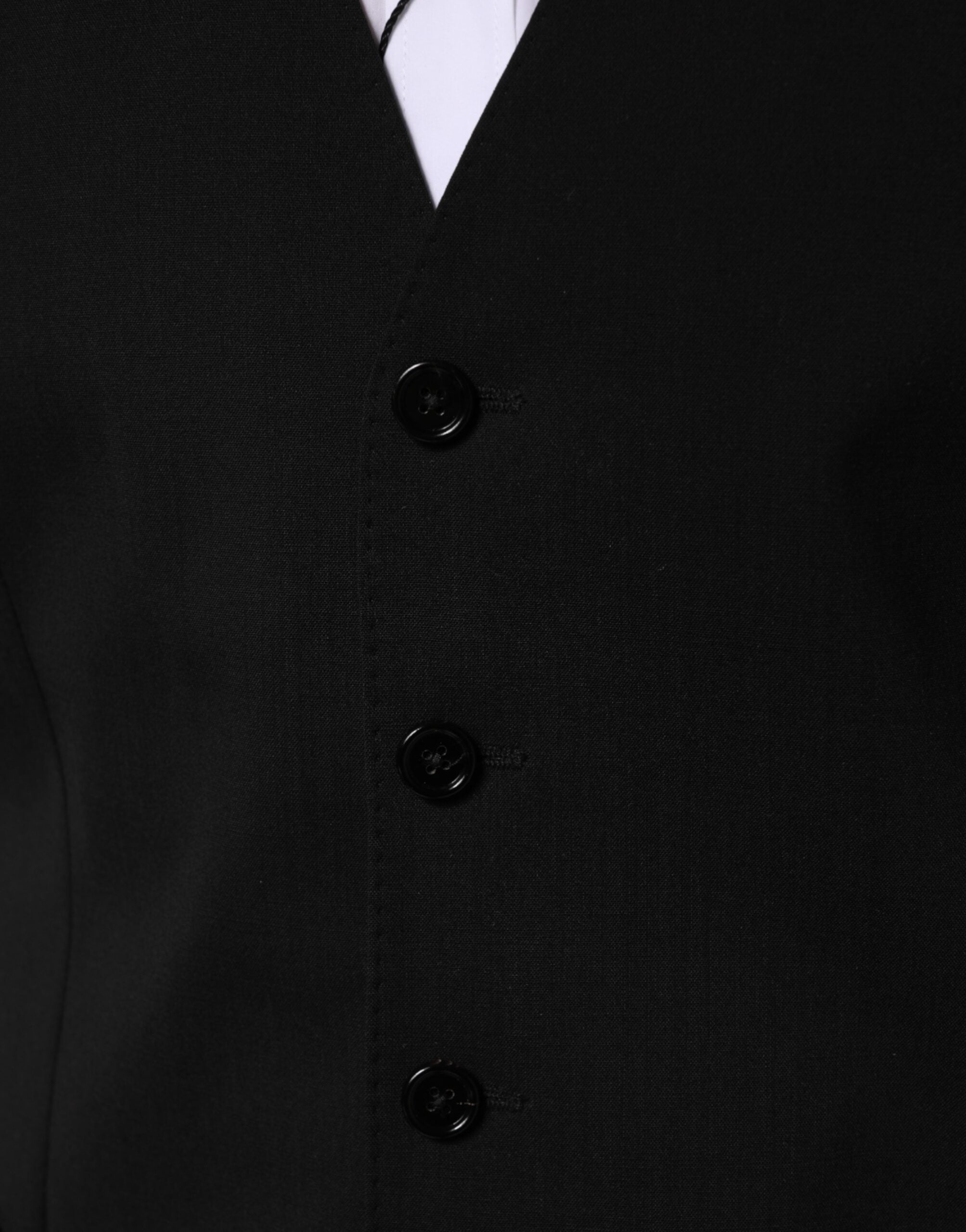 Discover the Dolce & Gabbana Black Wool Dress Waistcoat Vest, a masterpiece of Italian craftsmanship in luxurious virgin wool, perfect for elevating your formal attire.